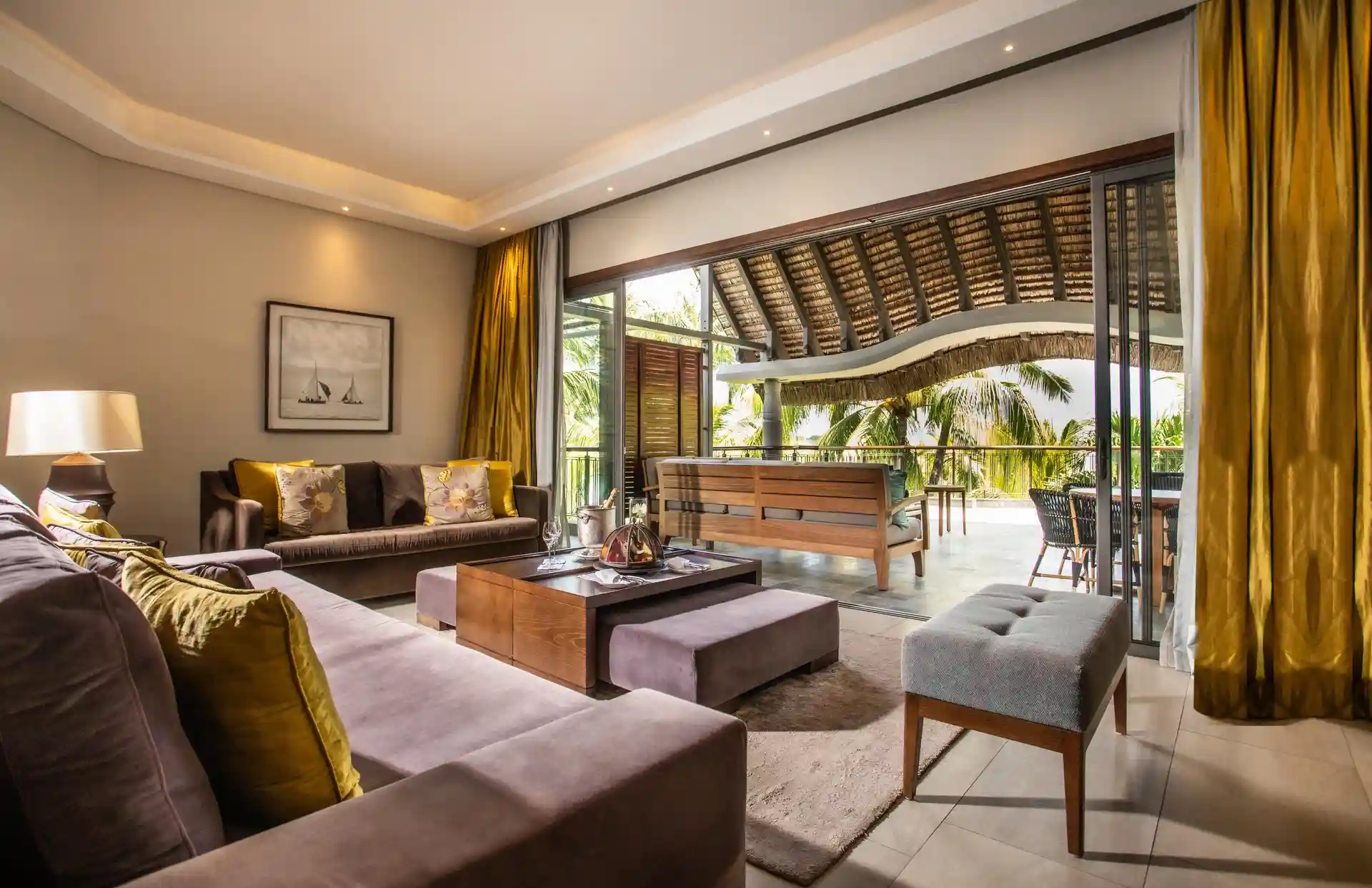 royal palm penthouse suite outdoor lounge with seating area, chairs, tables, and view of the surroundings