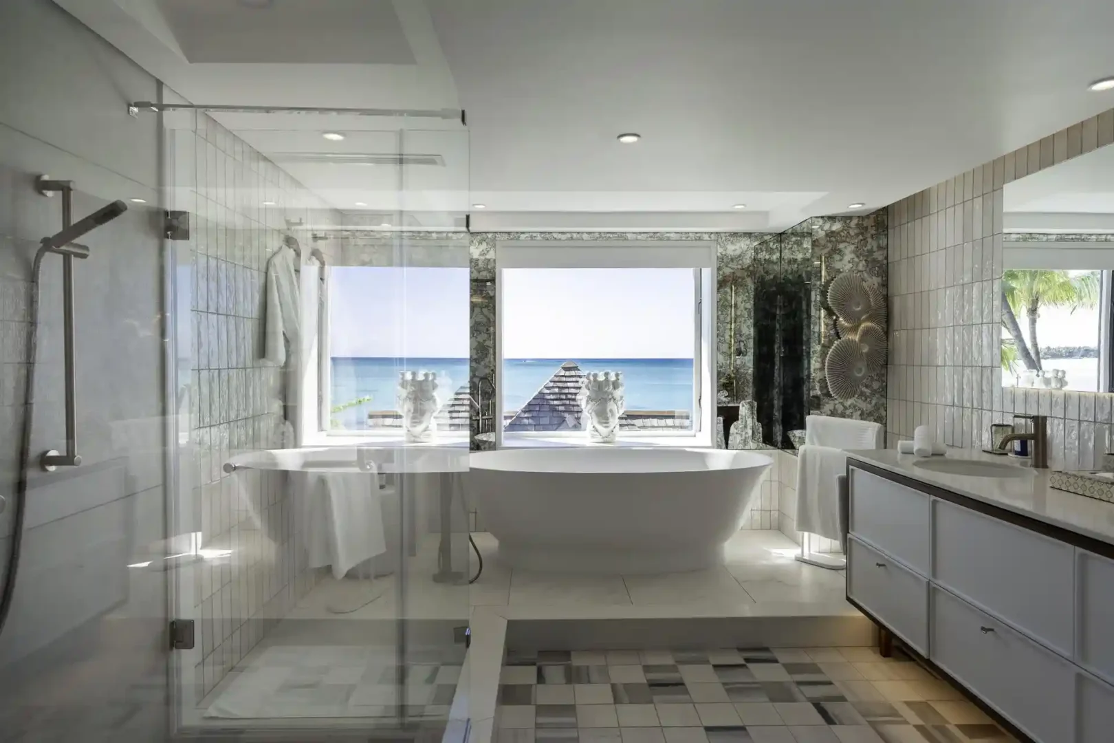royal palm royal villa bedroom with king-size bed, nightstands, lamps, and seating area