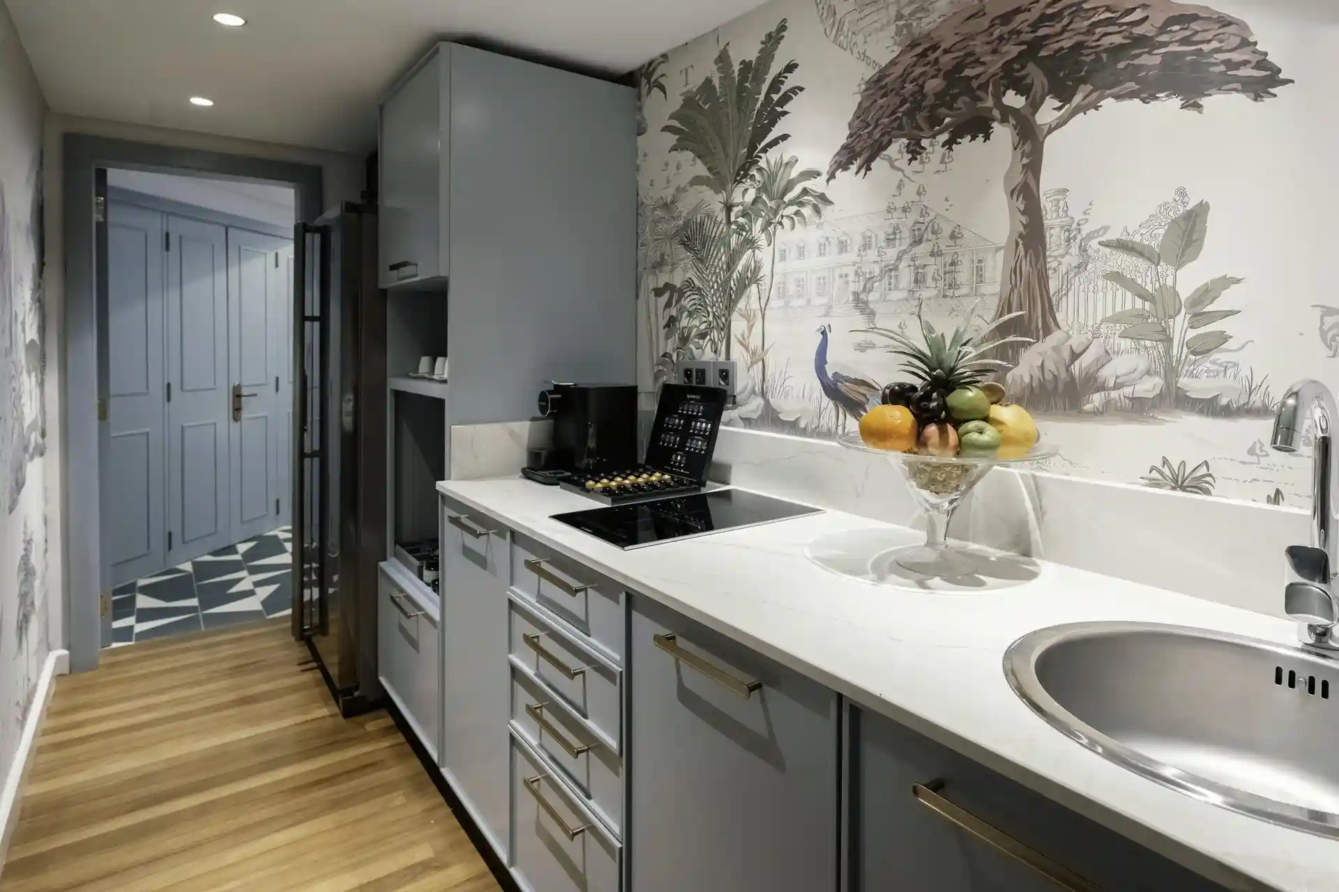 royal palm royal villa kitchen with countertops, cabinets, appliances, and dining area