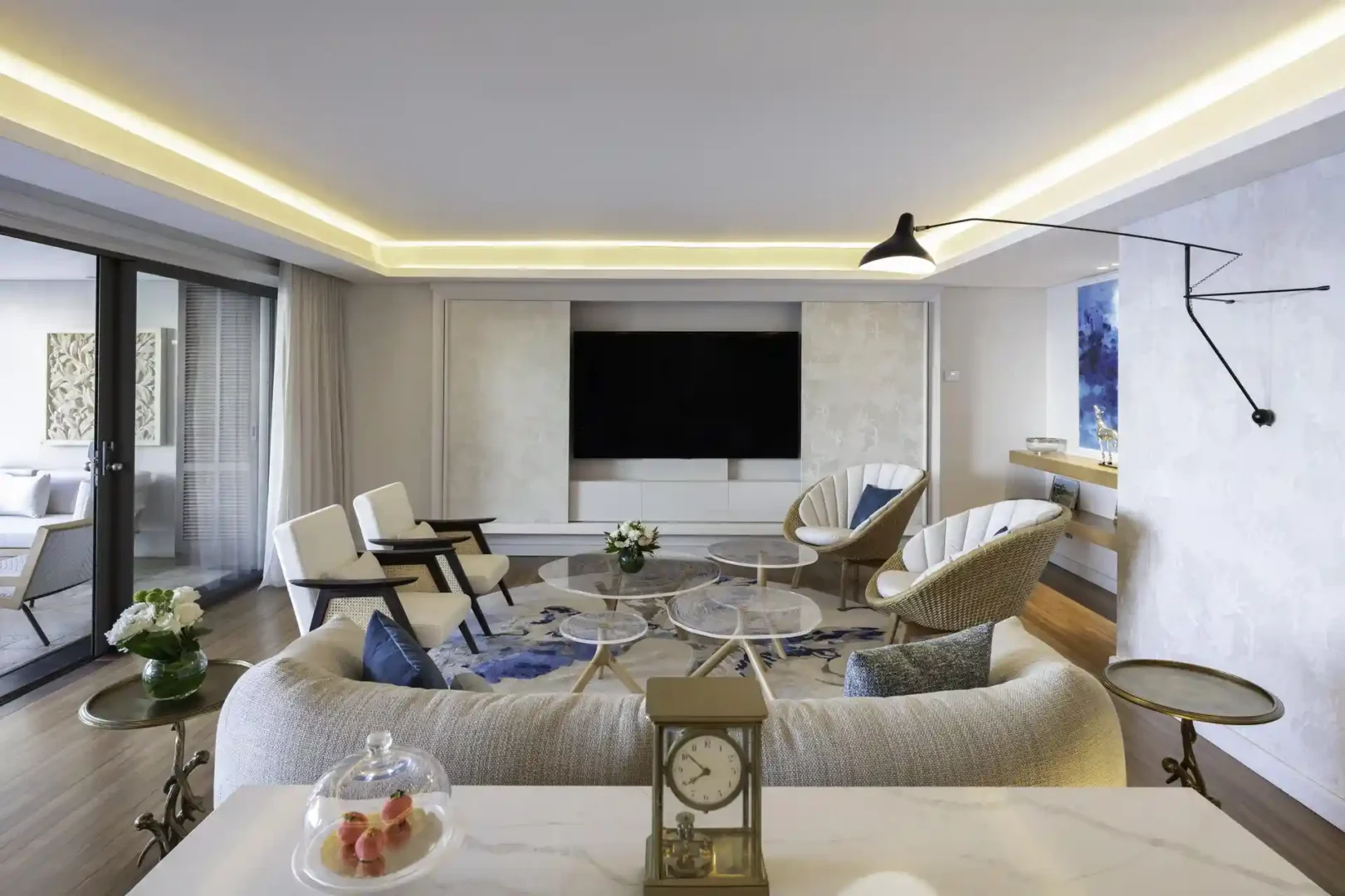 royal palm royal villa lounge with sofa, chairs, coffee table, and large windows