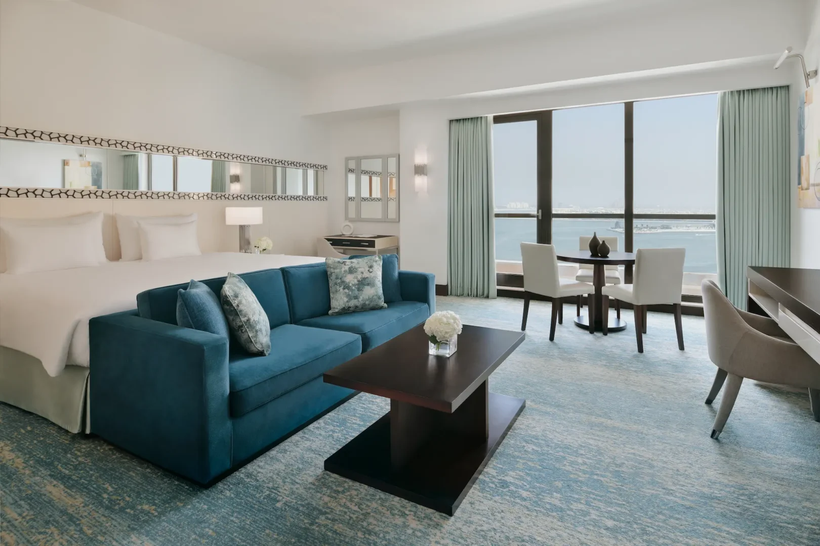 sea view junior suite wide shot at ja ocean view hotel overlooking the arabian gulf