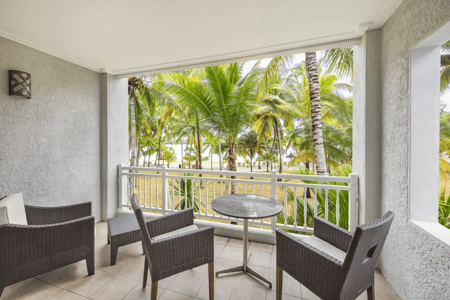 shandrani mauritius deluxe room with balcony hotel view and seating