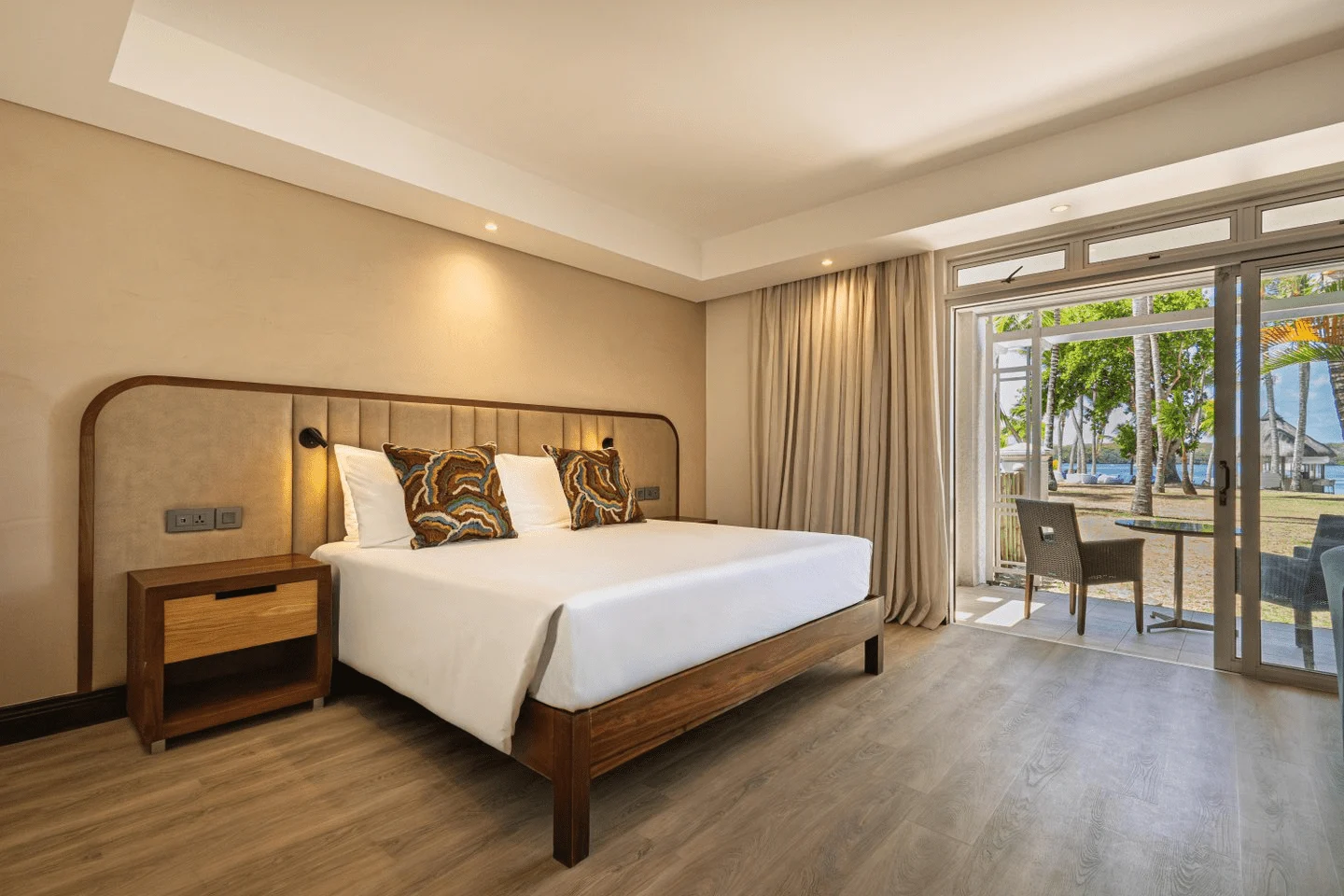 shandrani mauritius deluxe ground floor room bedroom with terrace hotel outdoor view