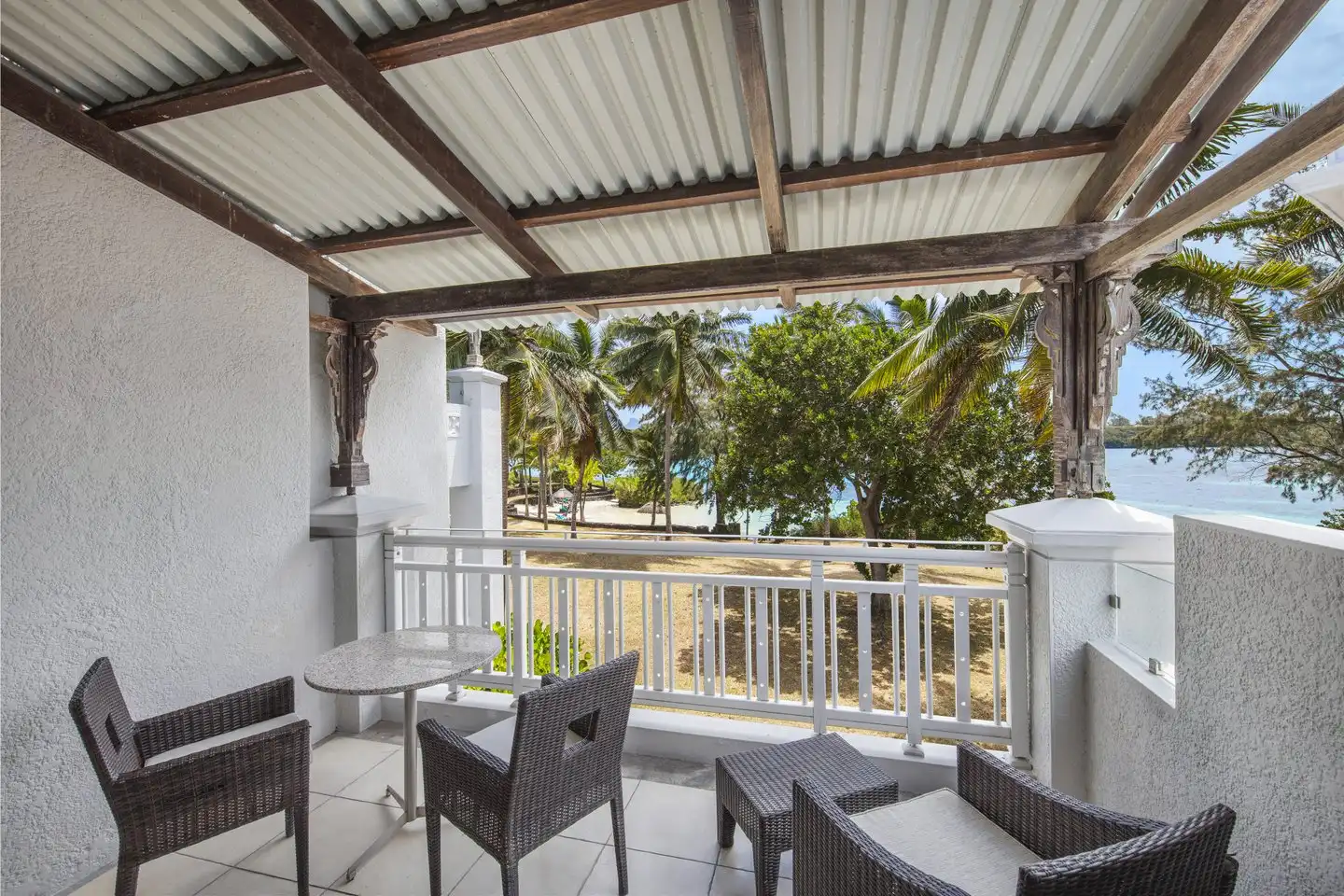 shandrani mauritius tropical room with balcony hotel view and seating
