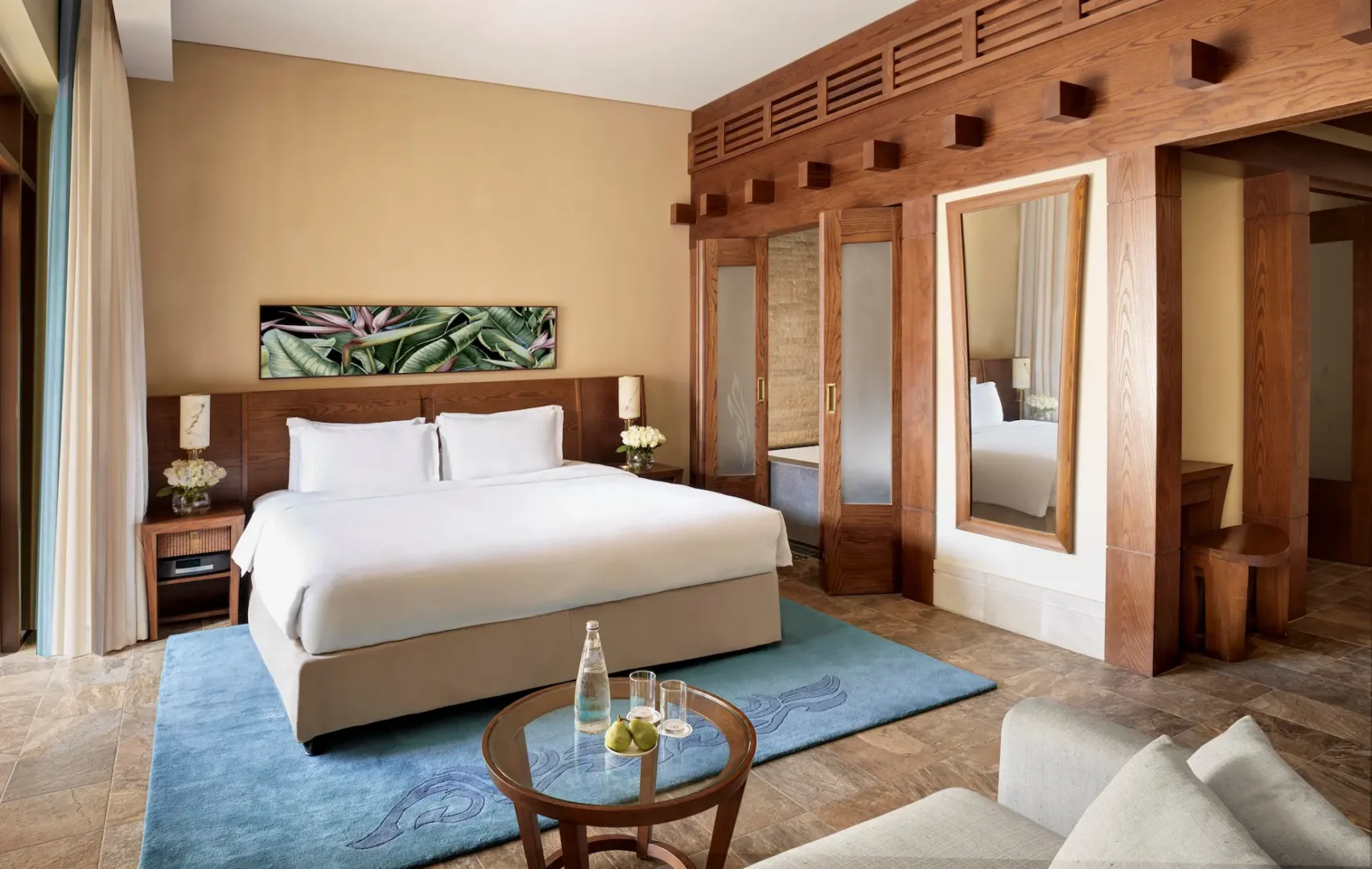 lassic room at sofitel dubai the palm, featuring modern decor, king bed, and balcony with sea or resort views