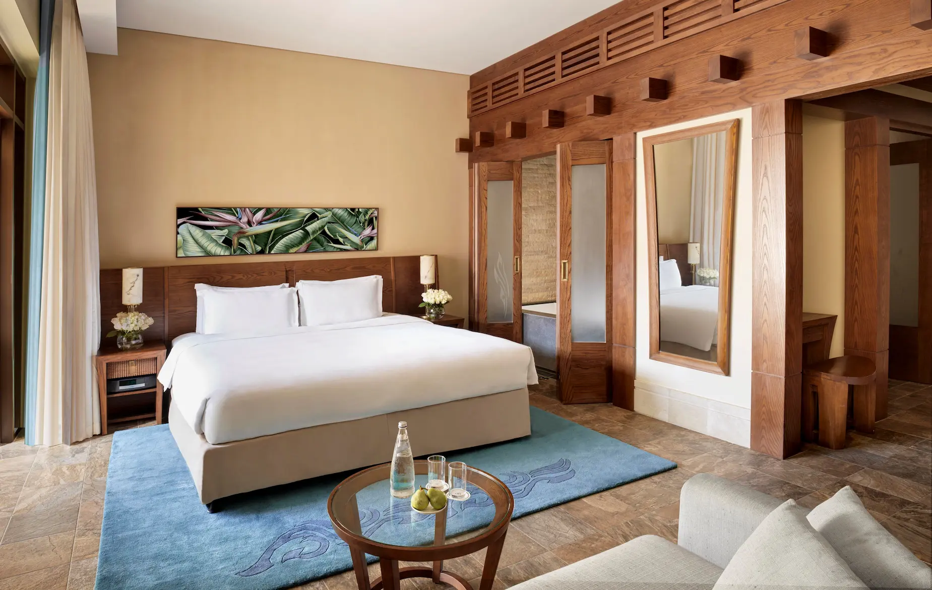 lassic room at sofitel dubai the palm, featuring modern decor, king bed, and balcony with sea or resort views