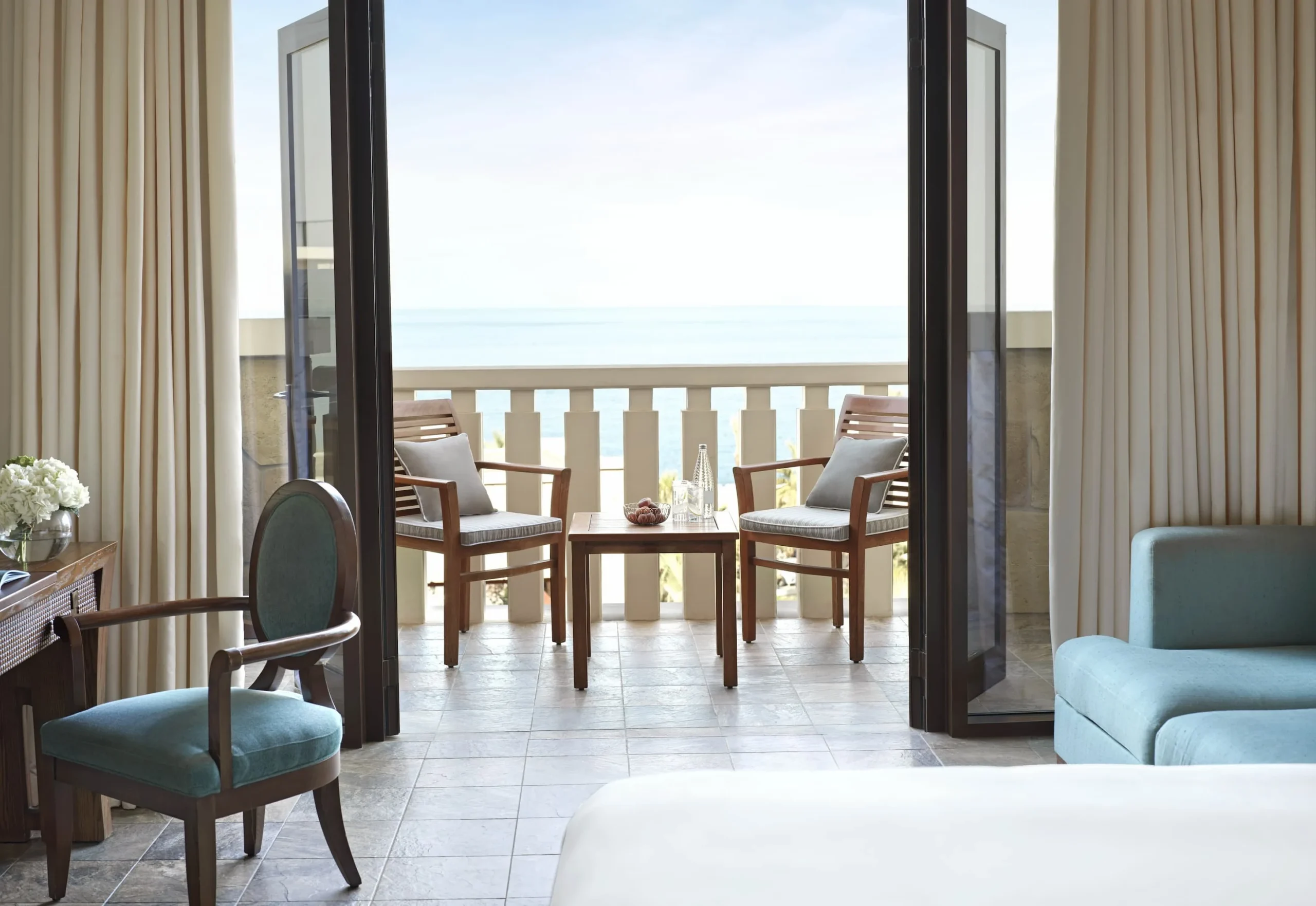 luxury sea view room at sofitel dubai the palm with modern decor, king bed, private balcony overlooking the Arabian Gulf, and elegant furnishings
