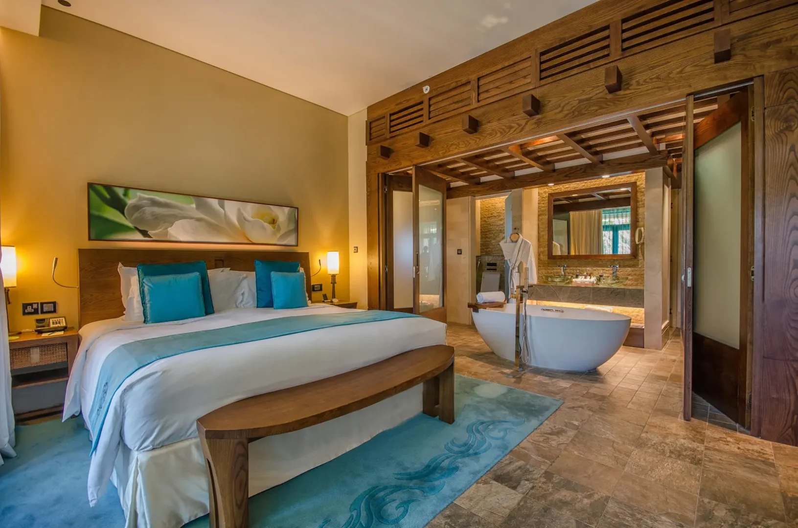 one-bedroom apartment at sofitel dubai the palm with king bed, modern decor, and elegant furnishings