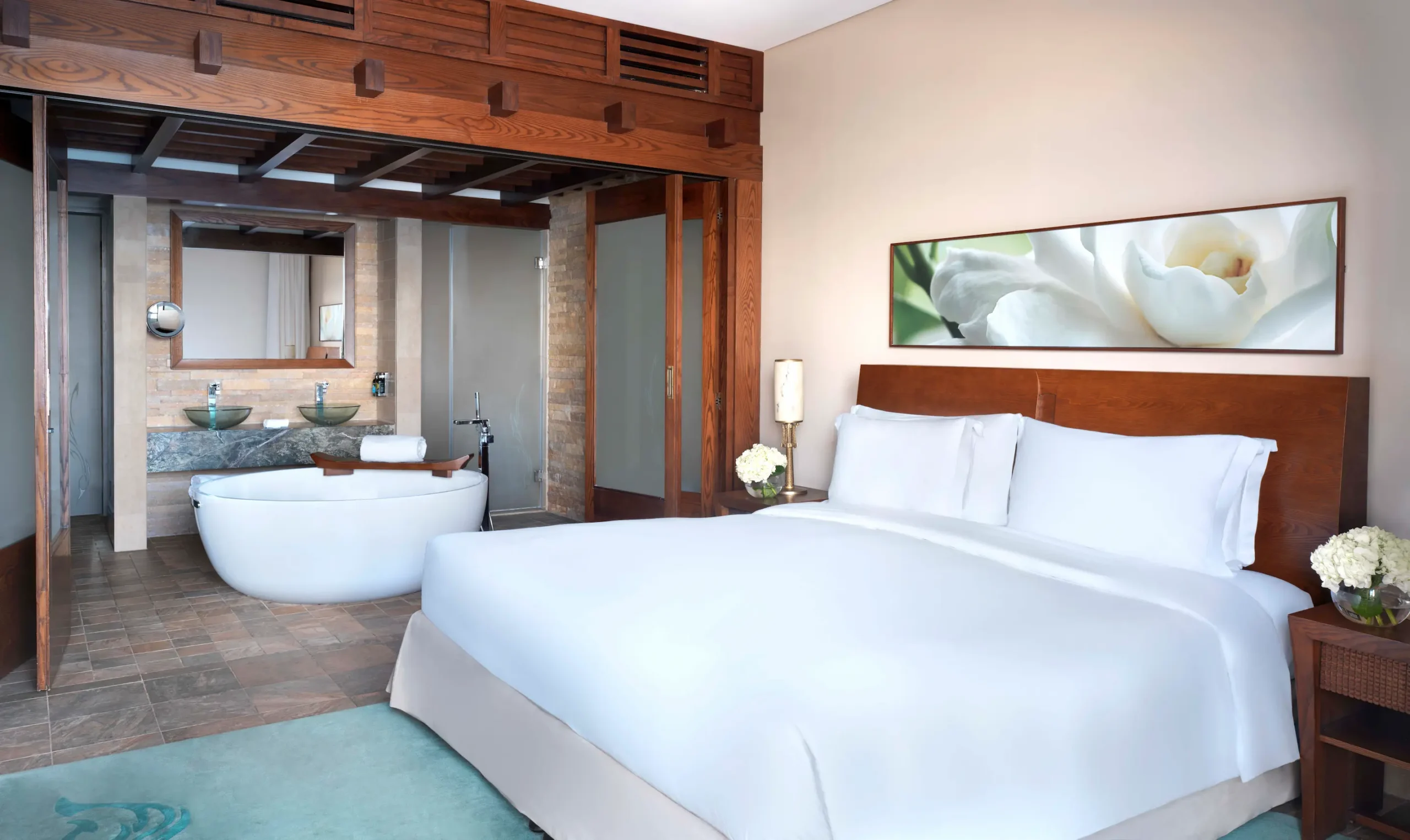 one-bedroom apartment at sofitel dubai the palm with sea view, modern decor, king bed, living area, and private balcony overlooking the Arabian Gulf