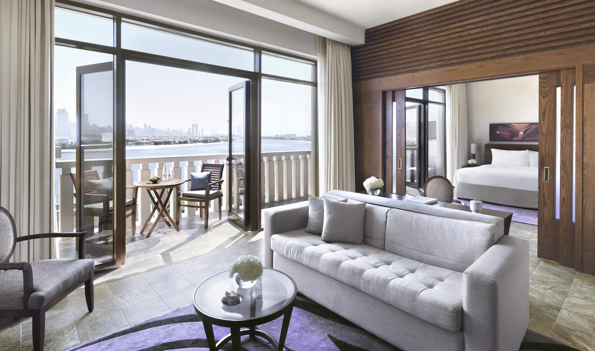 prestige suite at sofitel dubai the palm with spacious living area, king bed, luxurious bathroom, modern decor, and private balcony with sea or palm views