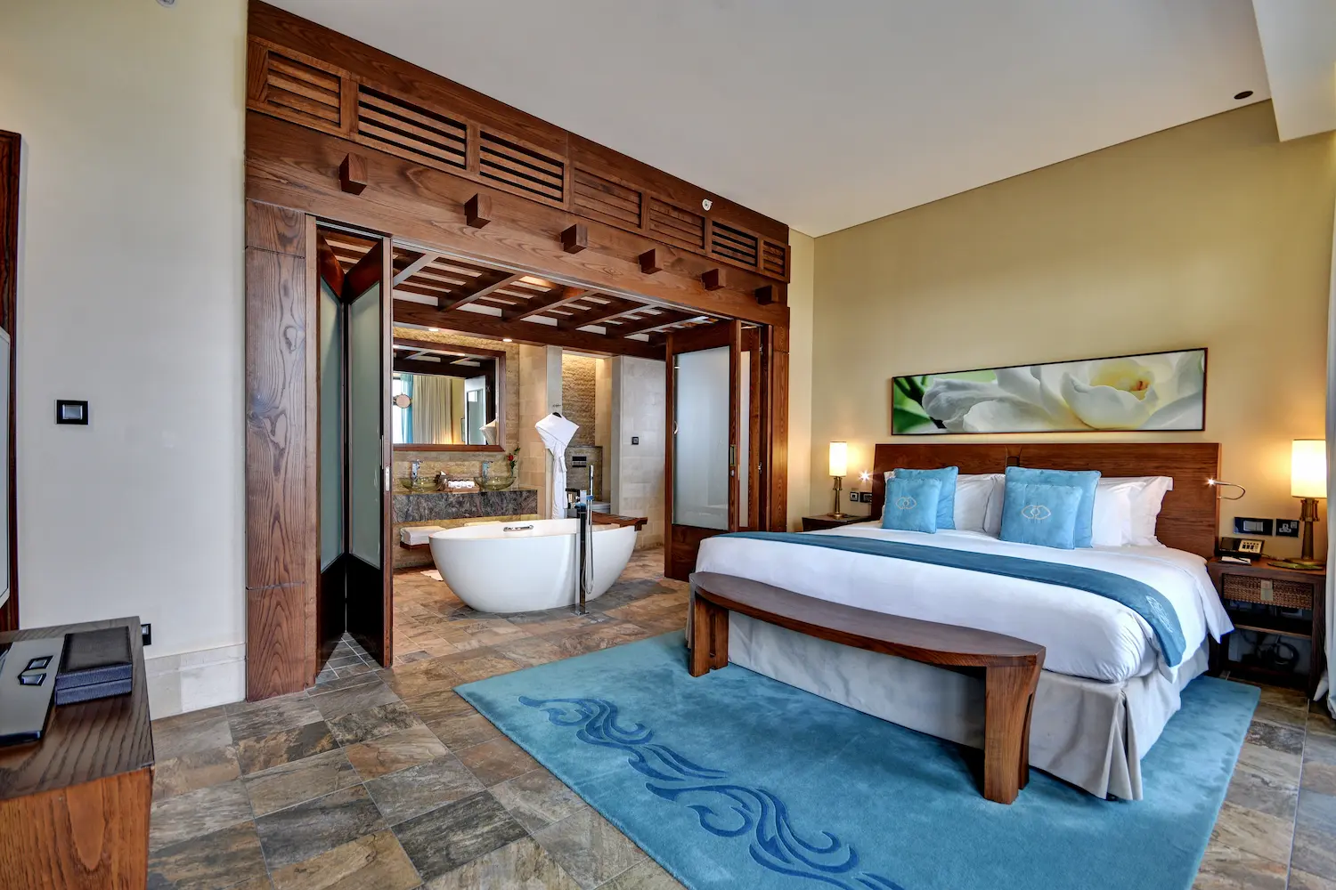 two-bedroom apartment at sofitel dubai the palm with modern decor, king beds, spacious living area, and private balcony with sea or resort views