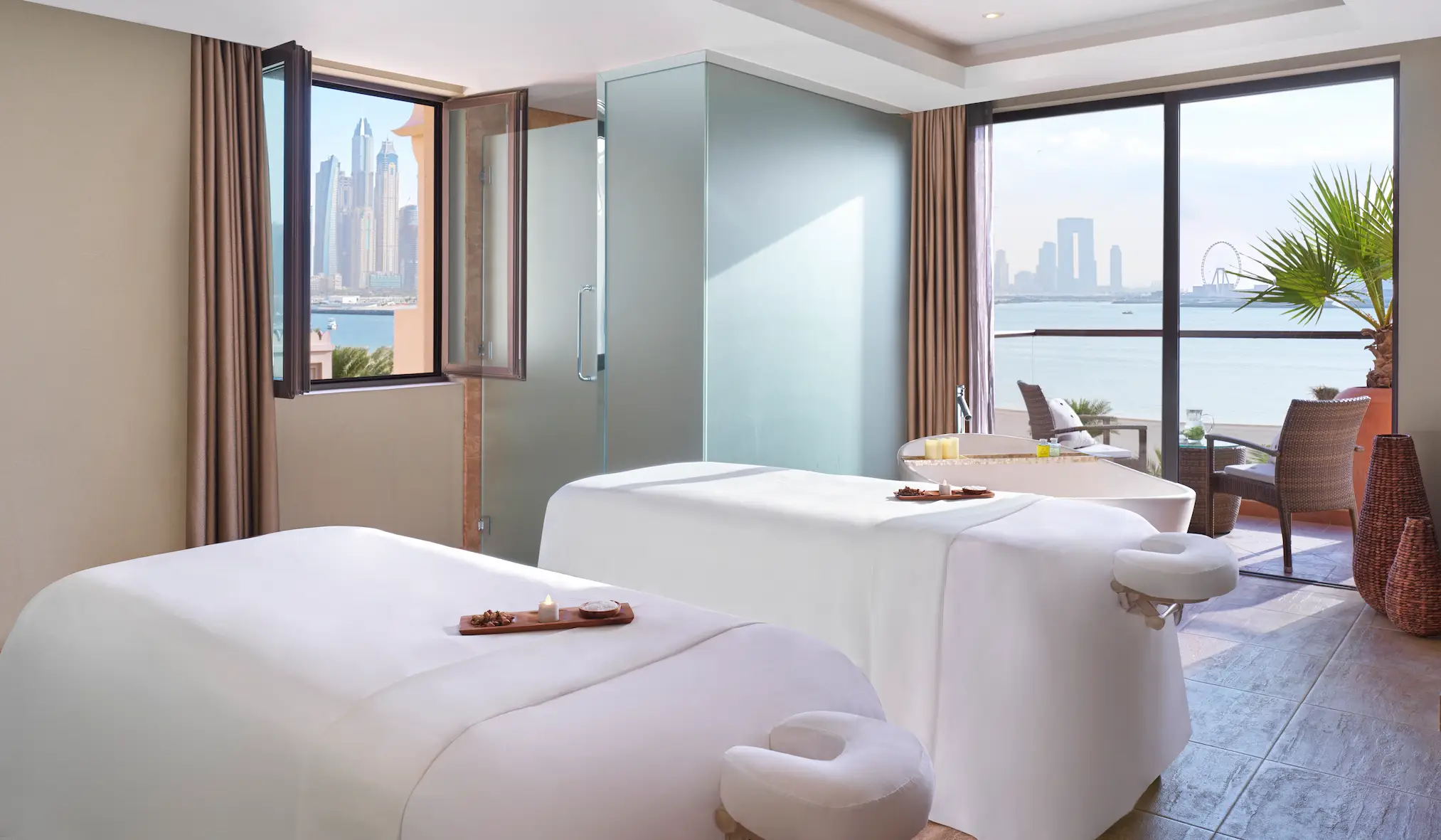 spa couples treatment room at fairmont the palm dubai resort with relaxing ambiance and twin massage beds