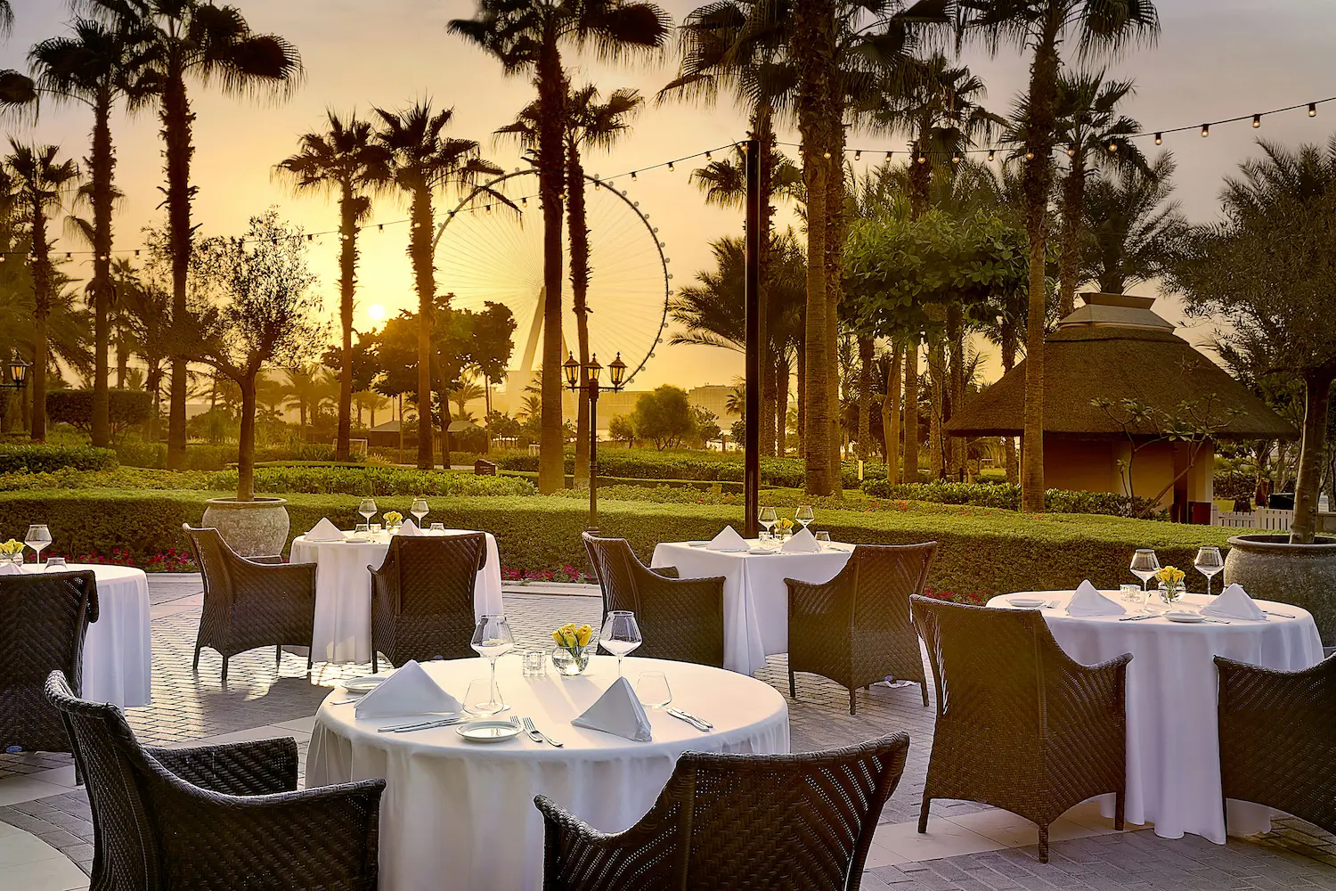 splendido piazza at sunset at the ritz-carlton dubai jbr featuring outdoor italian dining, elegant terrace seating, and warm sunset views in dubai marina