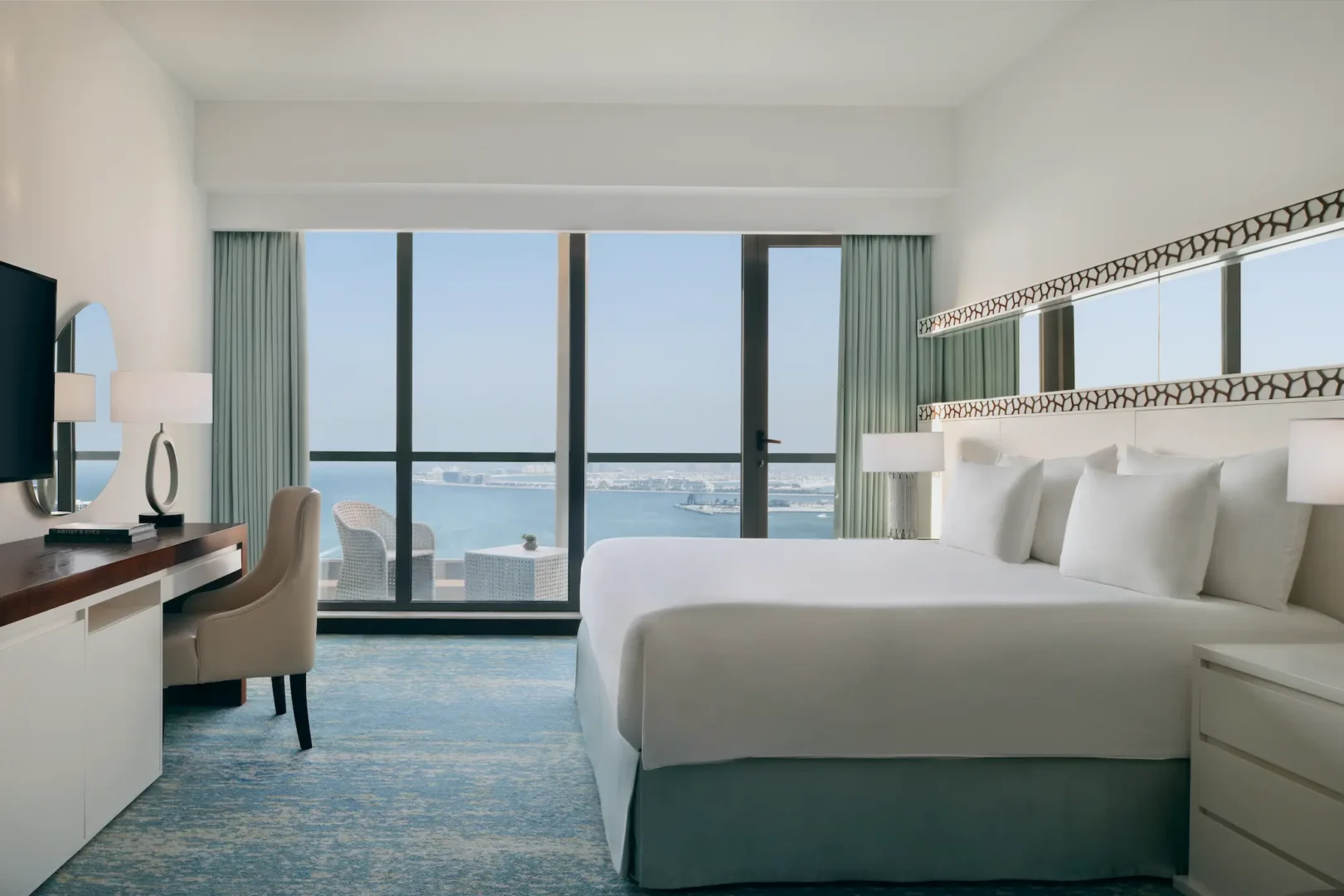 superior sea view room at ja ocean view hotel side view with king bed and balcony