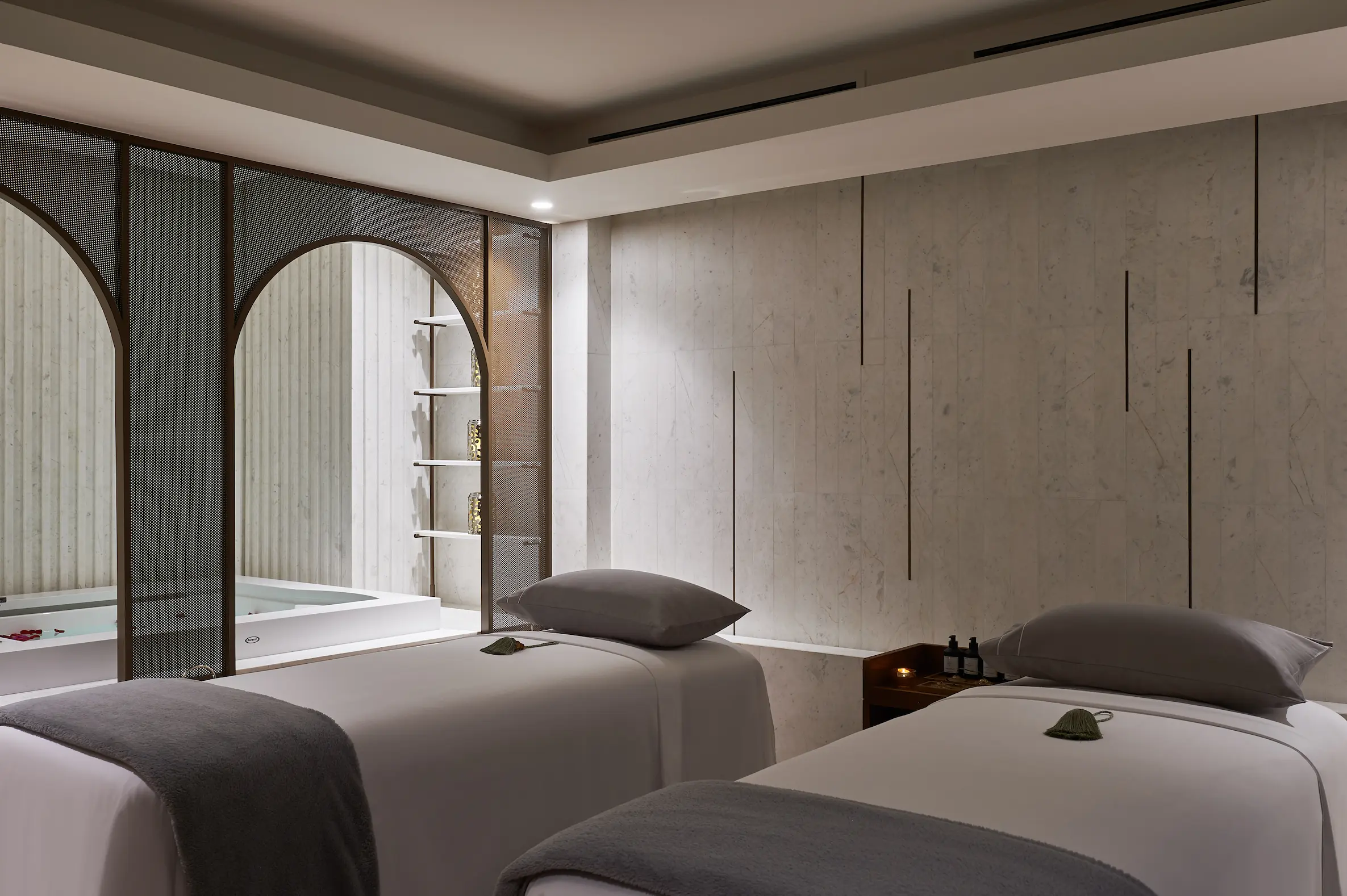 couple massage room at talise spa at Jumeirah Beach Hotel with twin treatment beds, soft lighting and serene wellness ambience