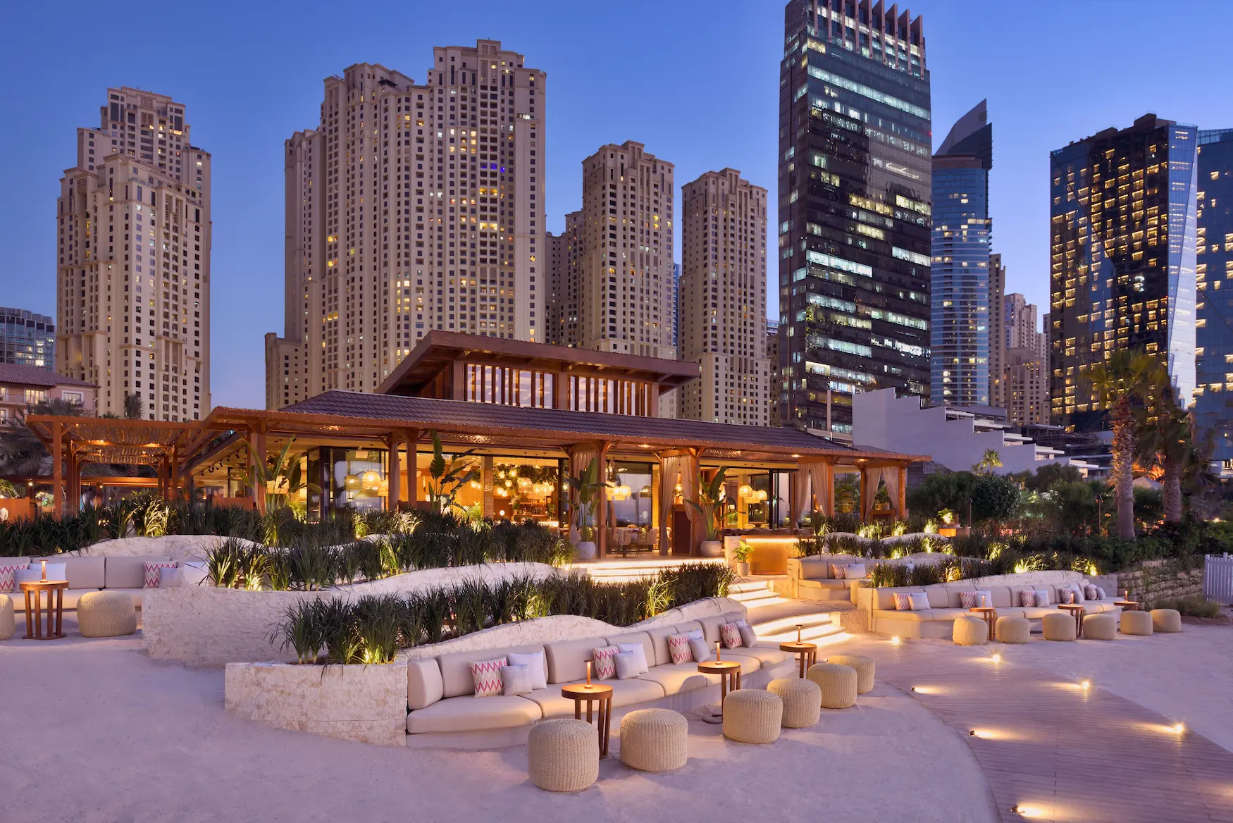 tamoka dubai cityscape at the ritz-carlton dubai jbr featuring vibrant beachfront dining with dubai marina skyline views and relaxed