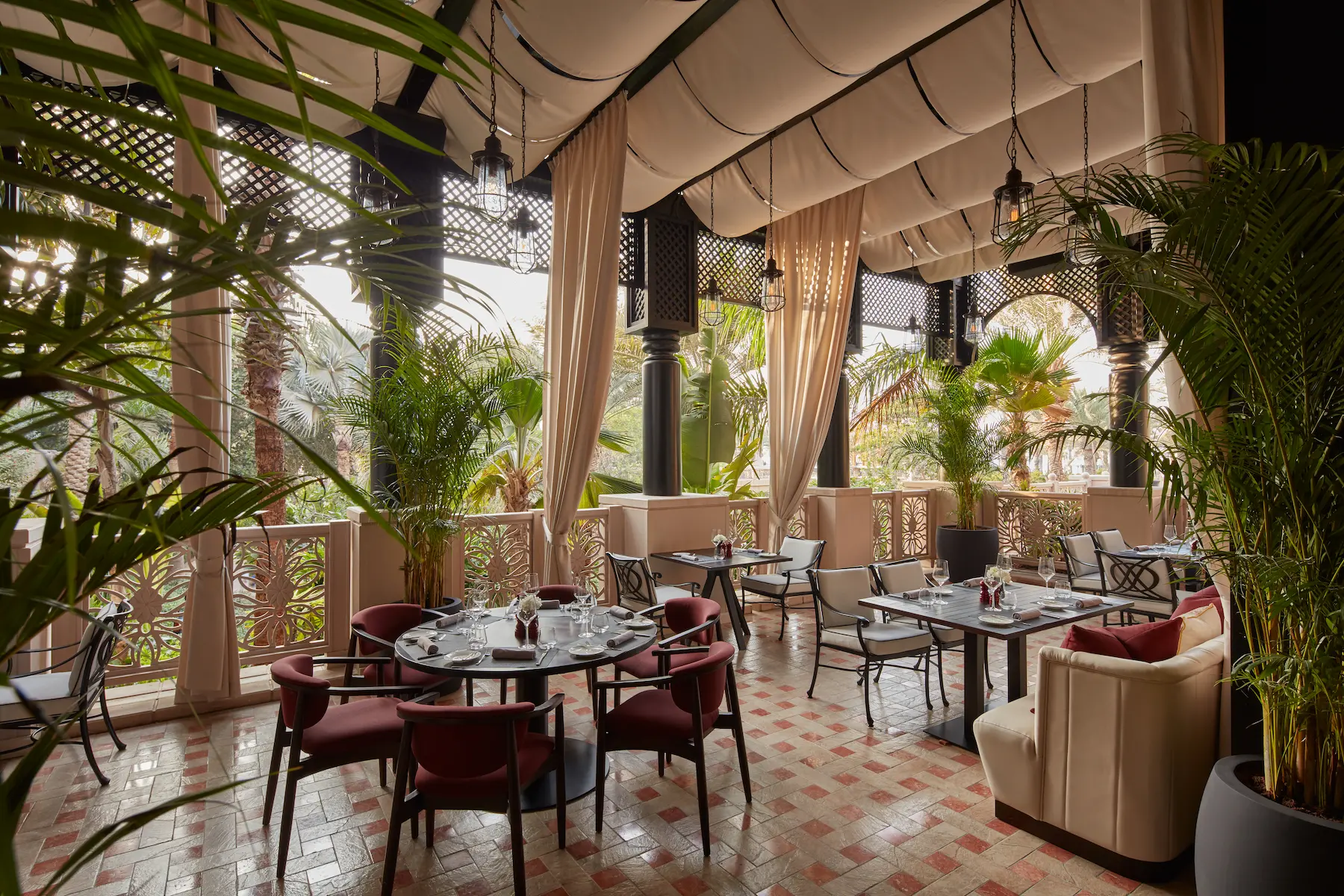 interior of the hide at jumeirah al qasr showcasing contemporary steakhouse dining with warm lighting and stylish décor