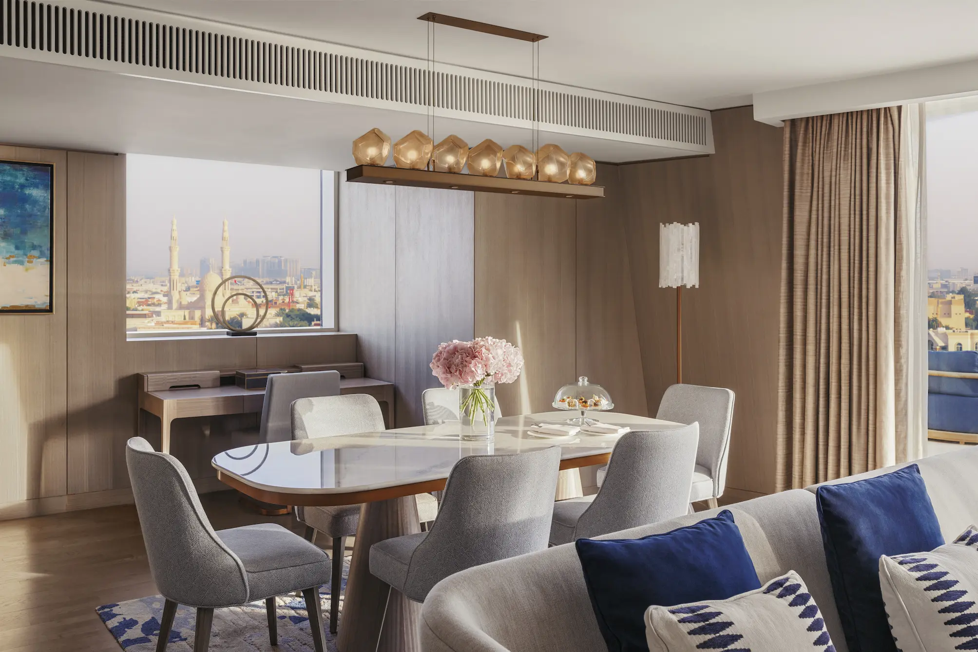 dining area in three bedroom suite at Jumeirah Beach Hotel with modern furnishings and panoramic sea views