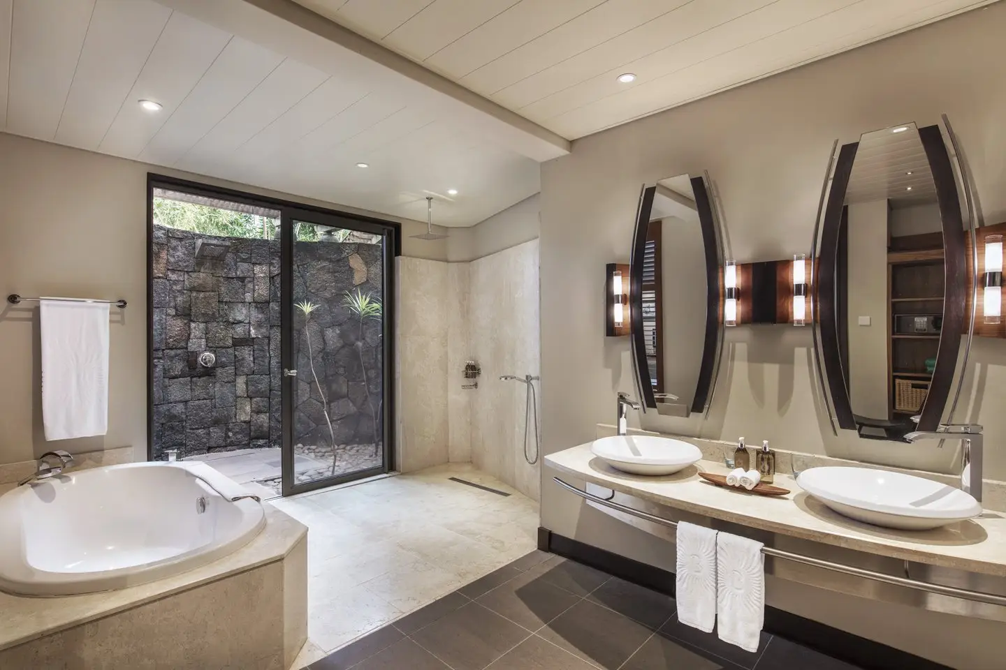trou aux biches 2 bedroom family suite outside shower with tropical surroundings