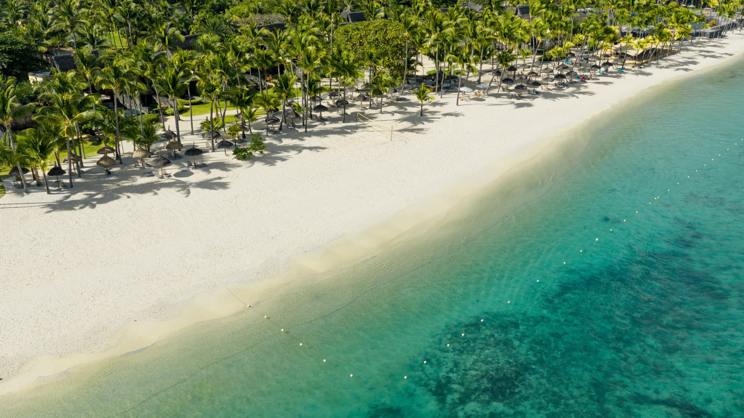 trou aux biches beachcomber mauritius aerial view of the white sand beach and turquoise lagoon along the resort coastline