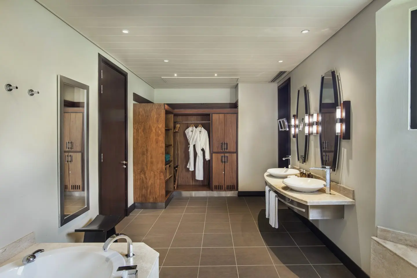 trou-aux-biches junior suite bathroom with modern fixtures, bathtub, and bright, airy design