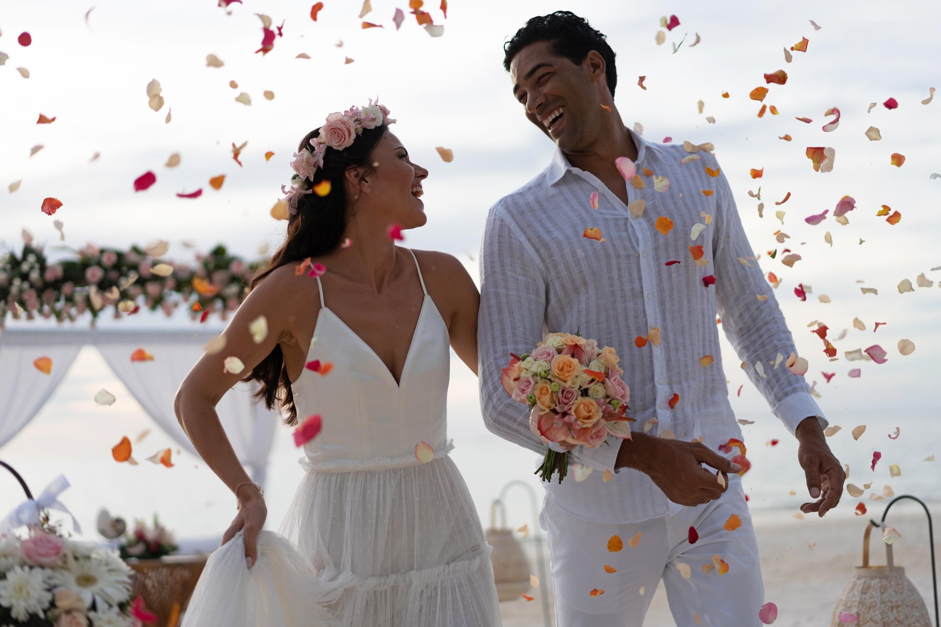 trou aux biches mauritius wedding with bride and groom on sandy beach with turquoise ocean backdrop