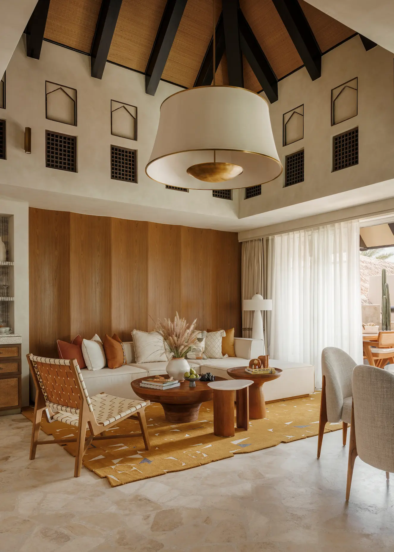 living room in two bedroom al bahar villa at Jumeirah Beach Hotel with modern seating, elegant décor and villa terrace access