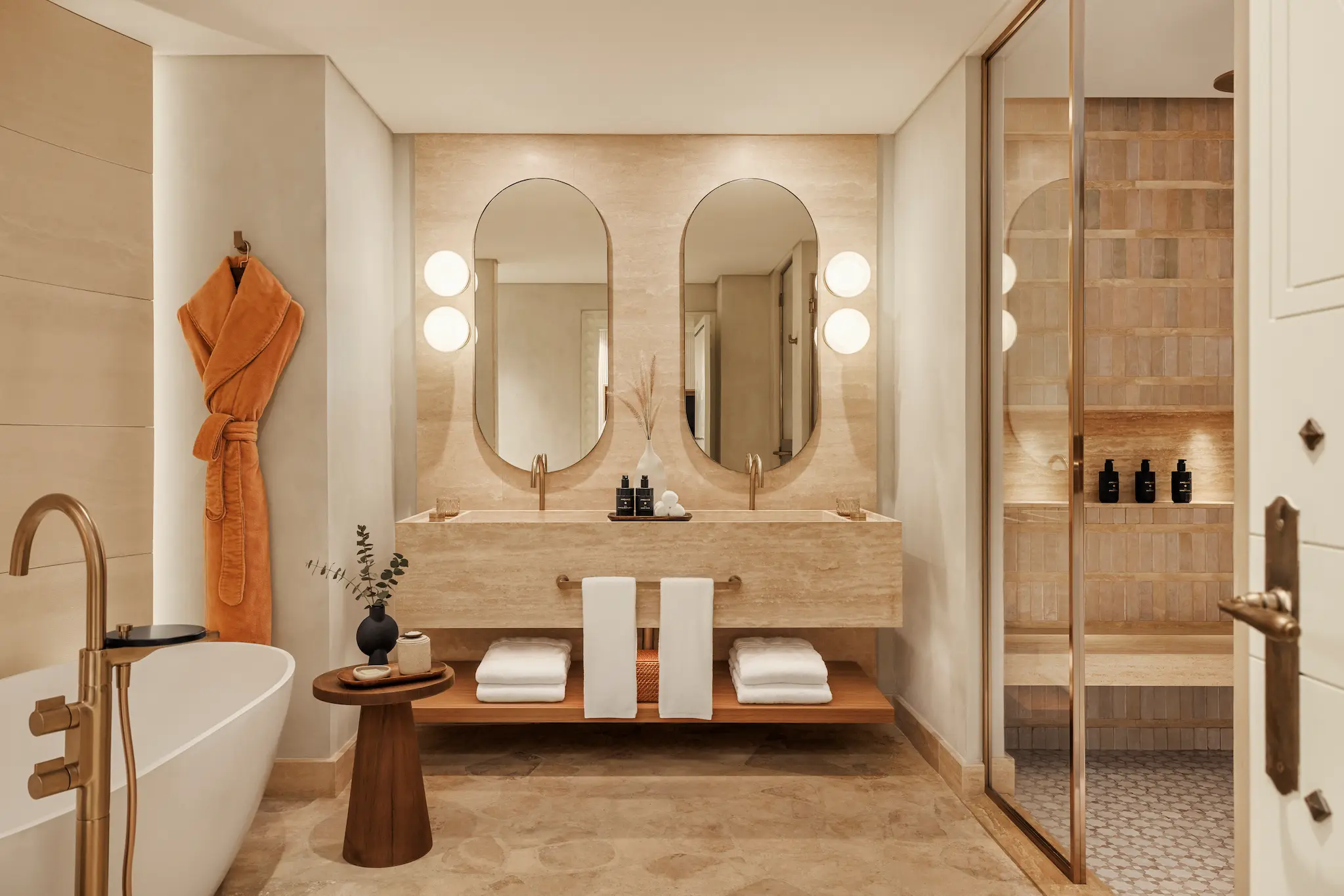 master bathroom in two bedroom al bahar villa at Jumeirah Beach Hotel with modern fittings, bathtub and elegant villa décor