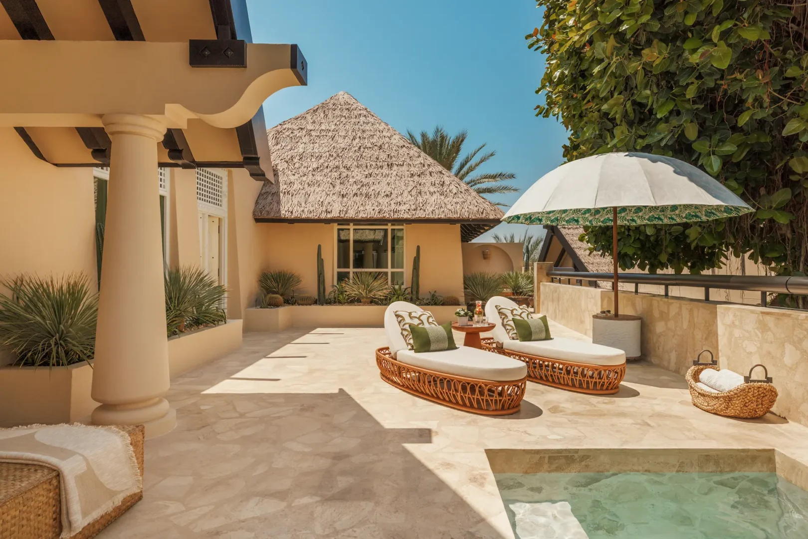 terrace of two bedroom al bahar villa at Jumeirah Beach Hotel with outdoor seating, plunge pool and arabian gulf views