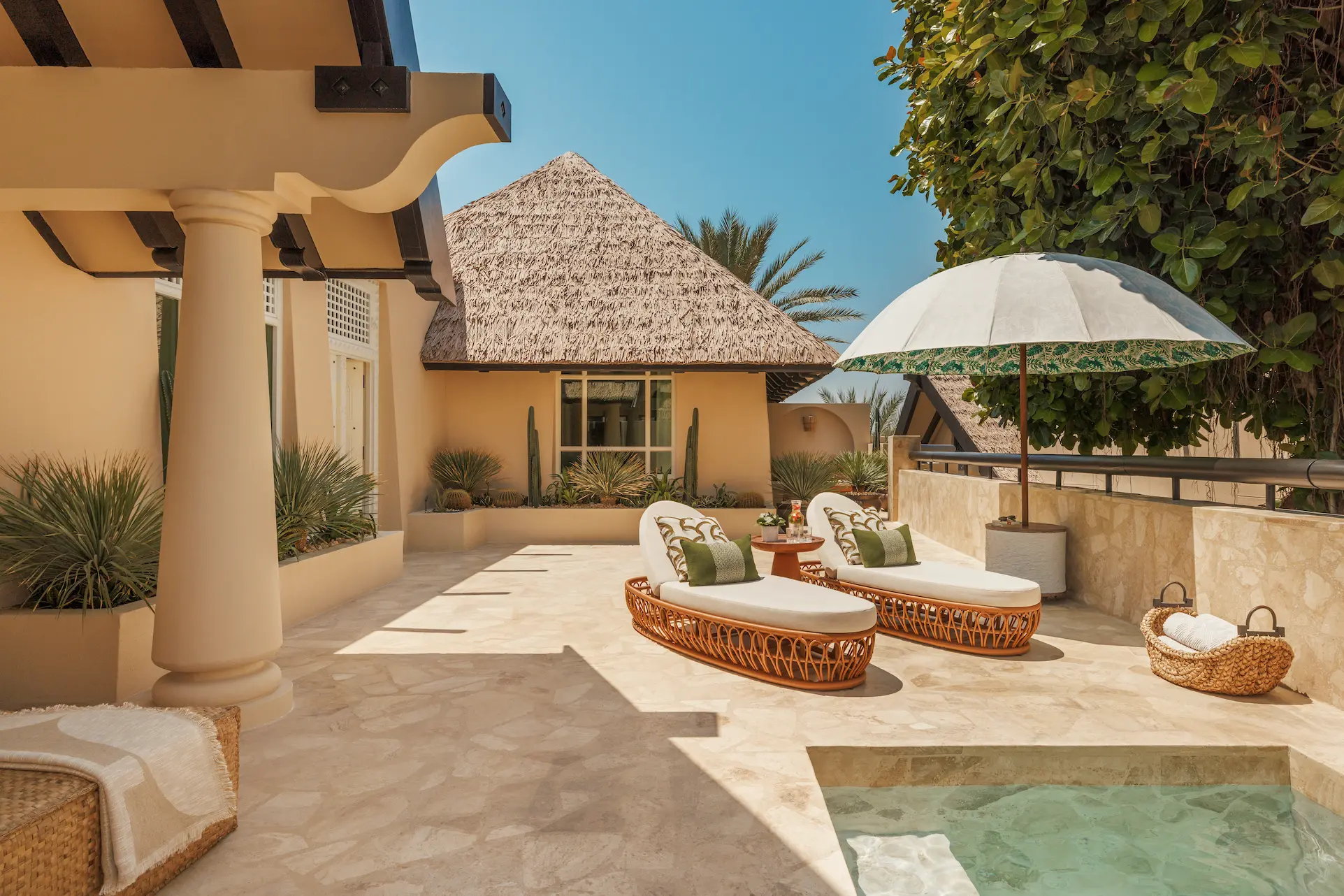 terrace of two bedroom al bahar villa at Jumeirah Beach Hotel with outdoor seating, plunge pool and arabian gulf views