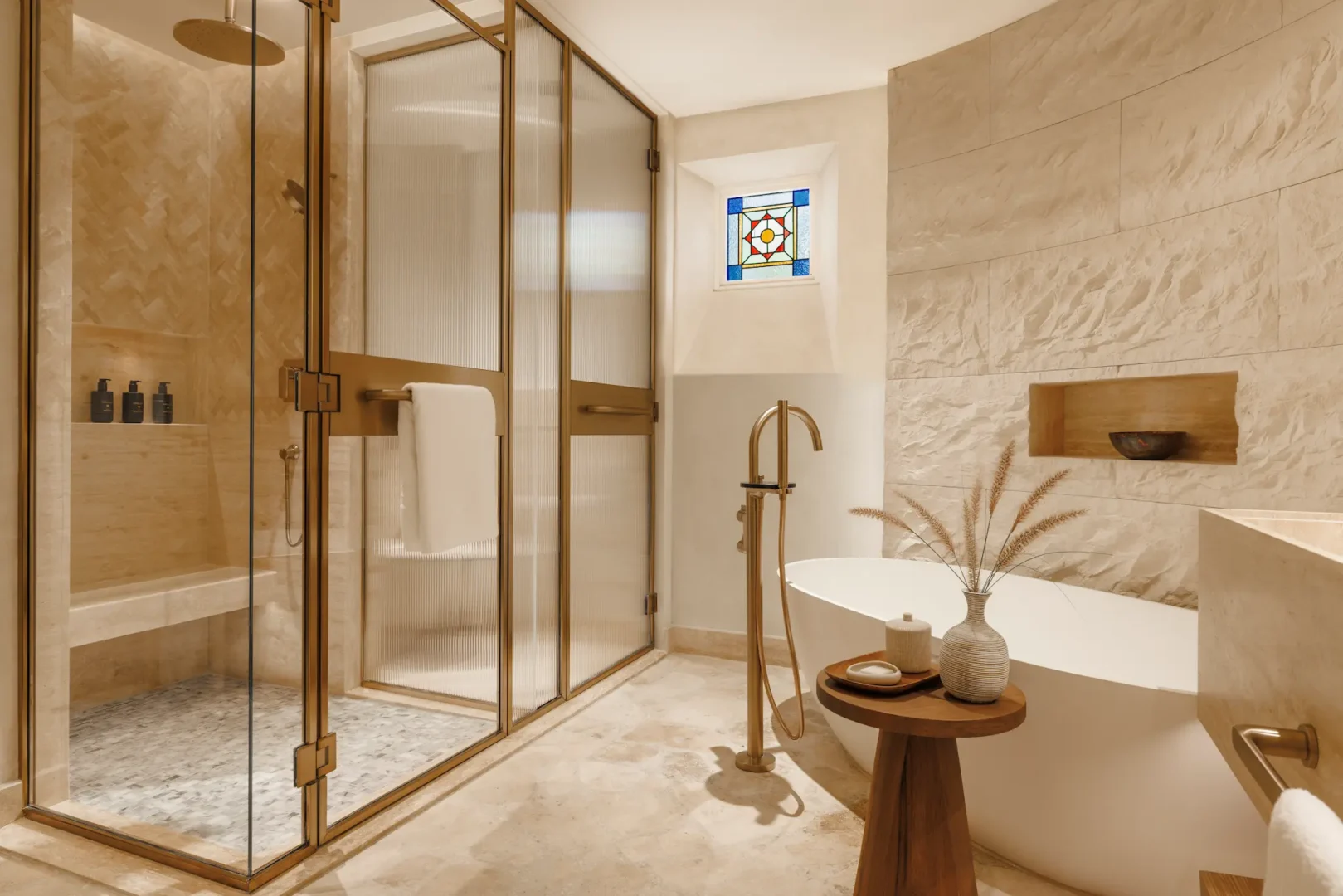 bathroom in twin bedroom of two bedroom al bahar villa at Jumeirah Beach Hotel with modern fittings, bathtub and elegant décor