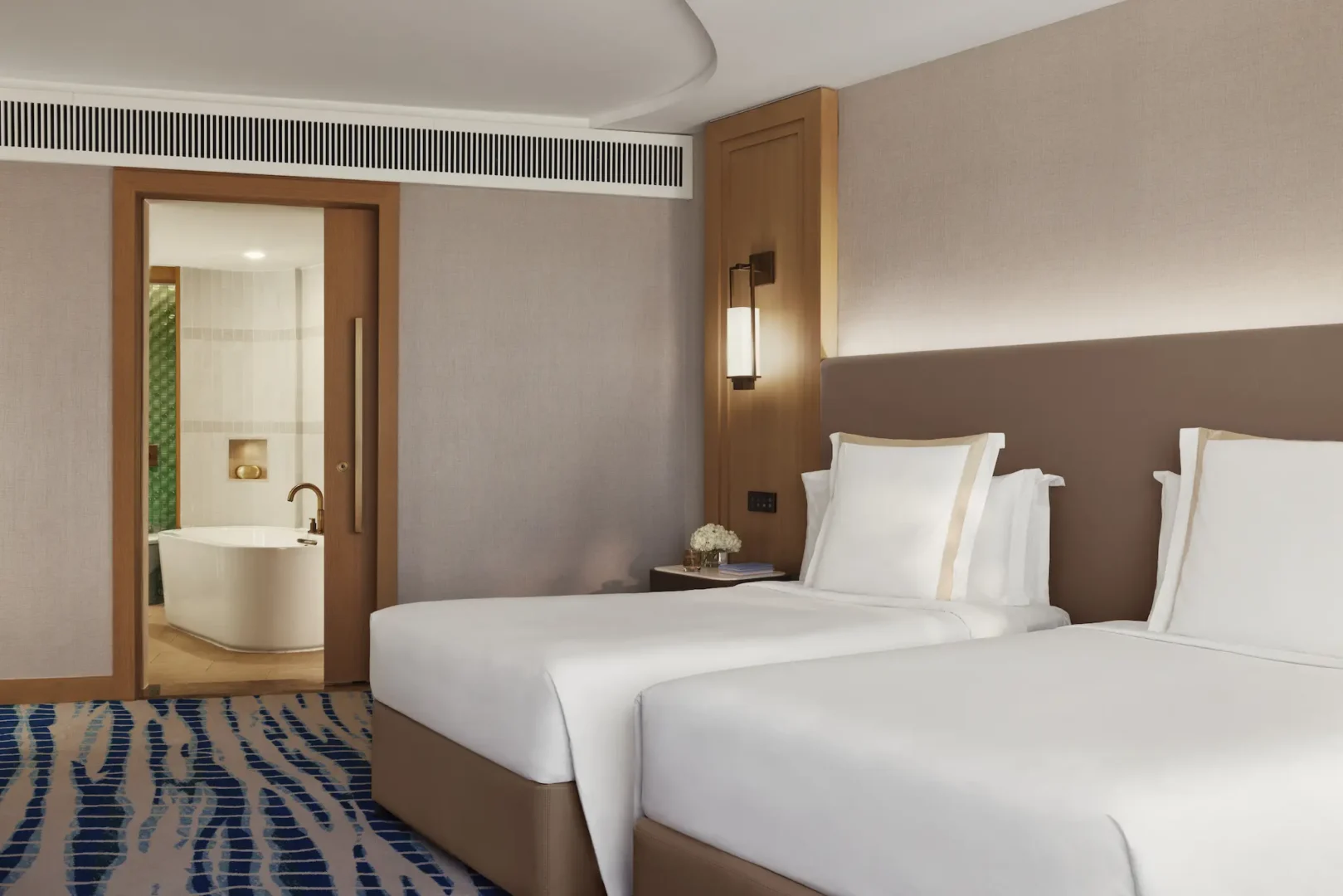 two bedroom ocean family deluxe room at Jumeirah Beach Hotel with sea views, spacious family layout and contemporary interiors
