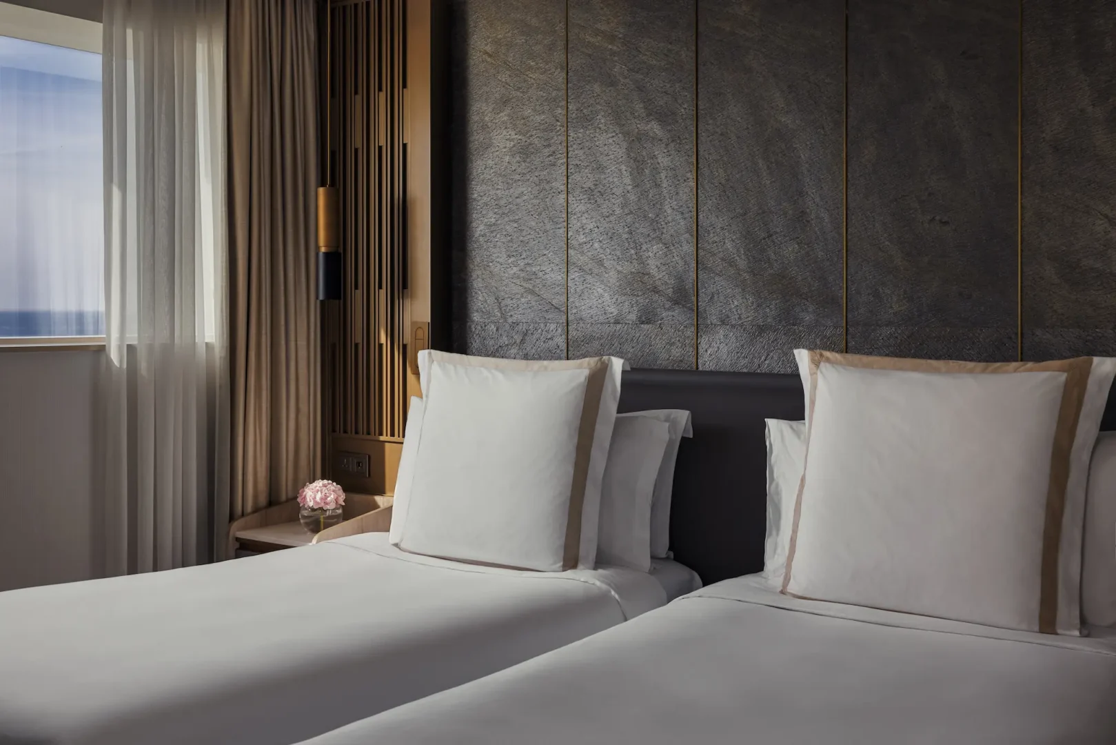 twin bedroom in two bedroom suite at Jumeirah Beach Hotel with twin beds and modern sea-view interiors