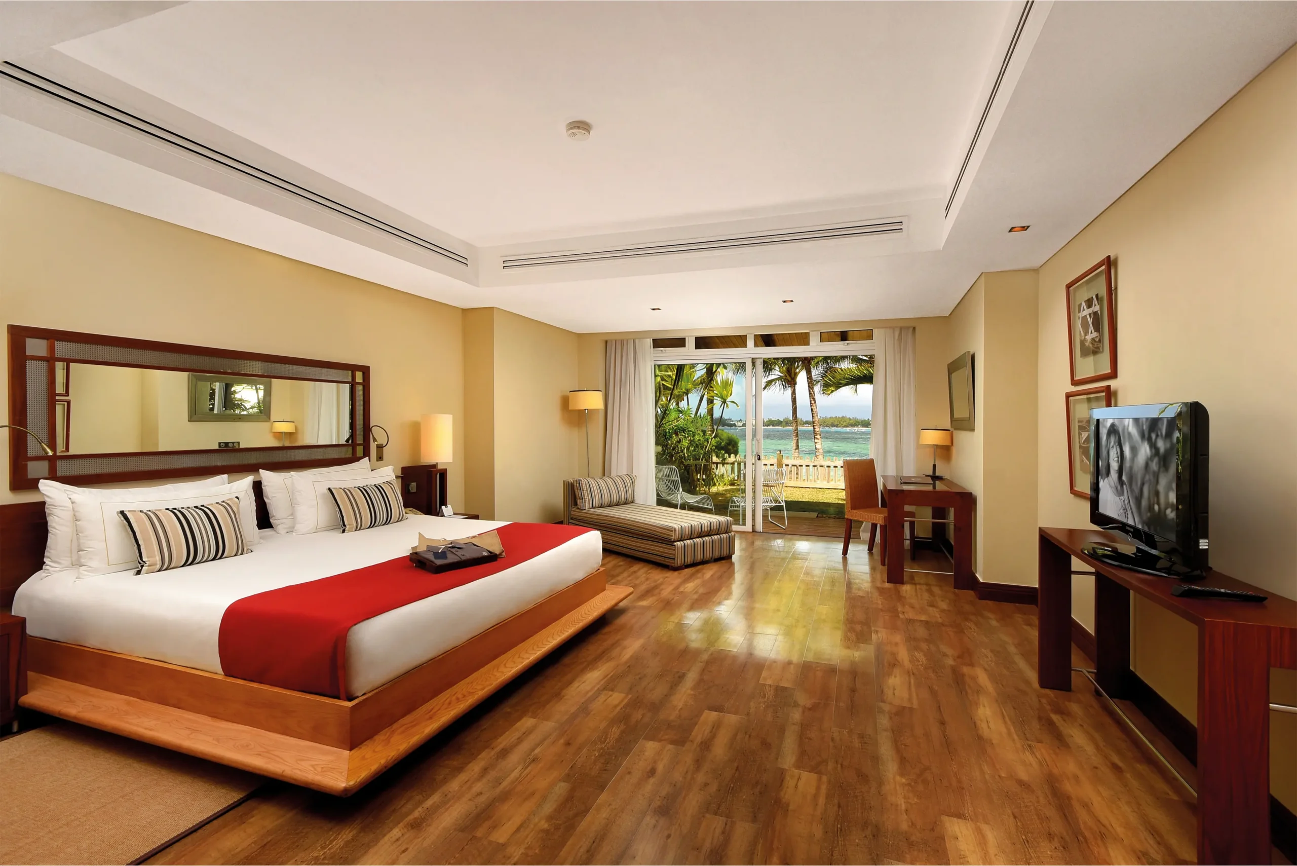 master bedroom in two-bedroom family suite at shandrani resort with king-size bed and elegant decor