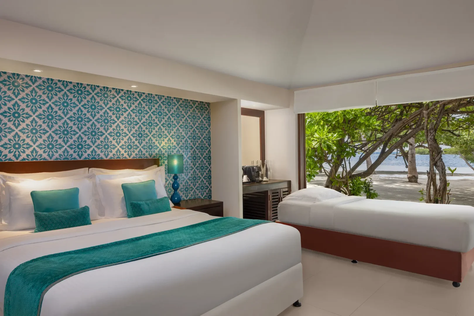 beach villa extra bed setup at adaaran select hudhuranfushi maldives
