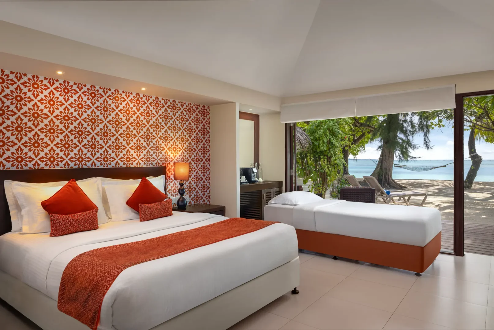 deluxe beach villa additional bed arrangement at adaaran select hudhuranfushi maldives