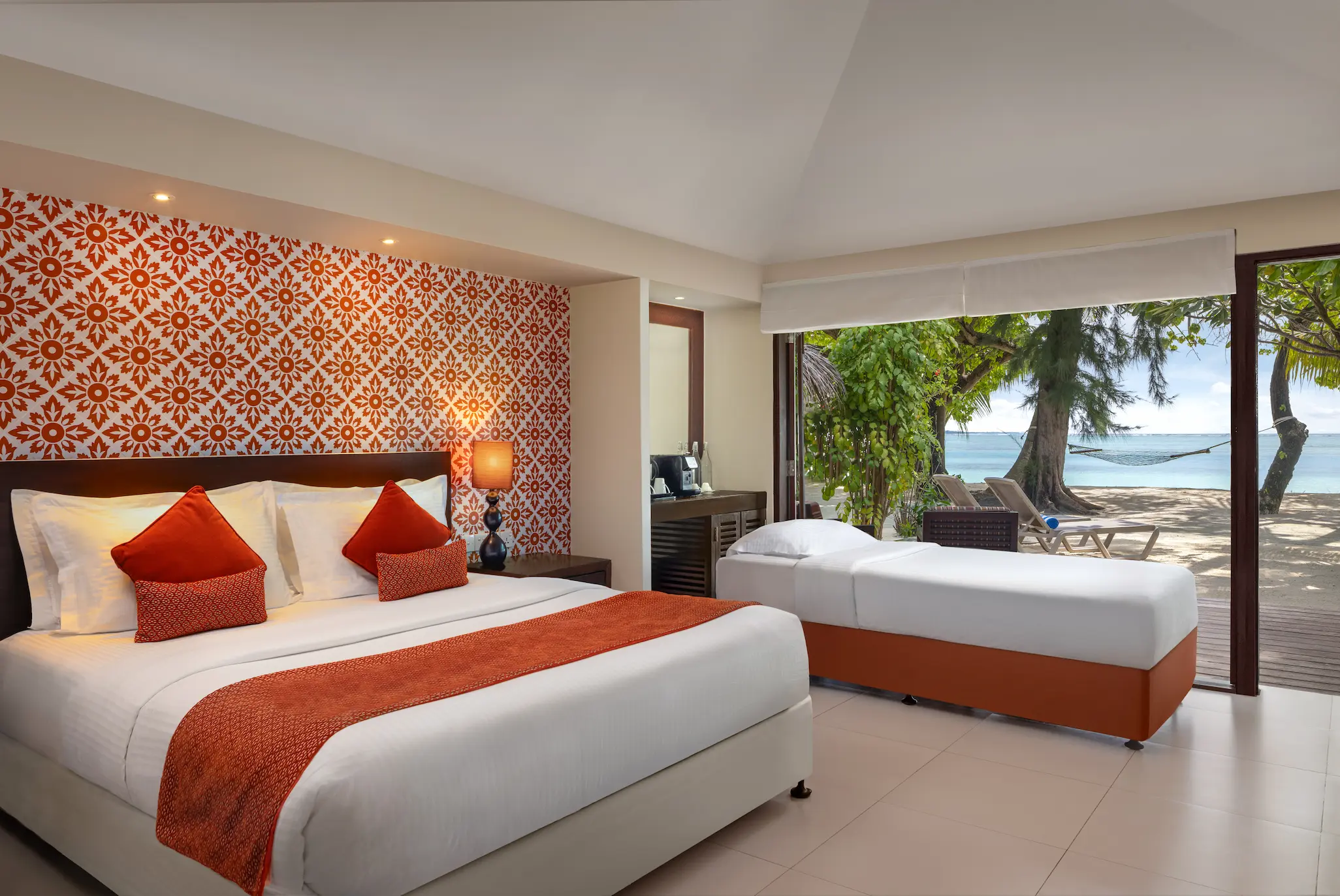deluxe beach villa additional bed arrangement at adaaran select hudhuranfushi maldives