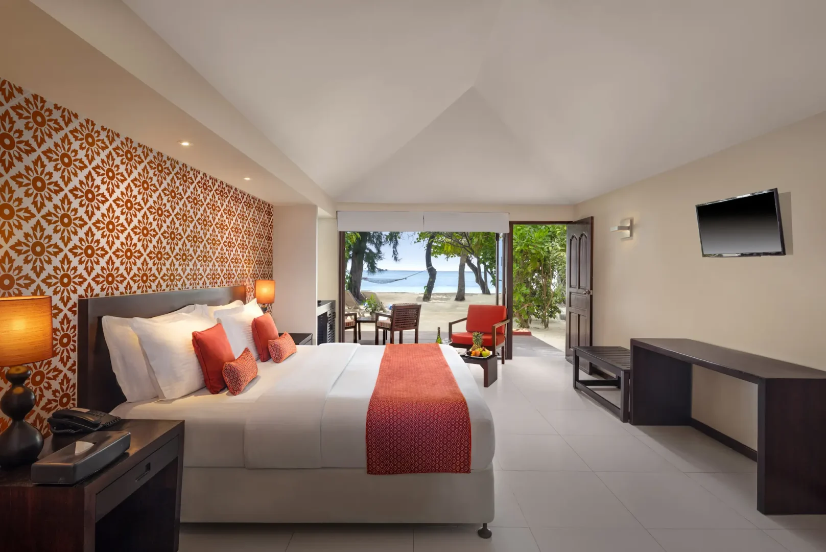 deluxe beach villa indoor living space at adaaran select hudhuranfushi maldives
