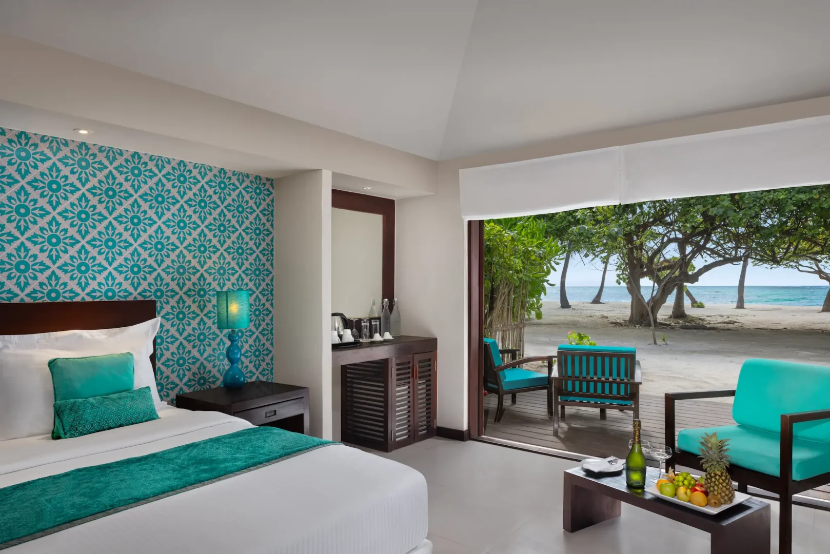 family beach villa indoor relaxation area at adaaran select hudhuranfushi maldives