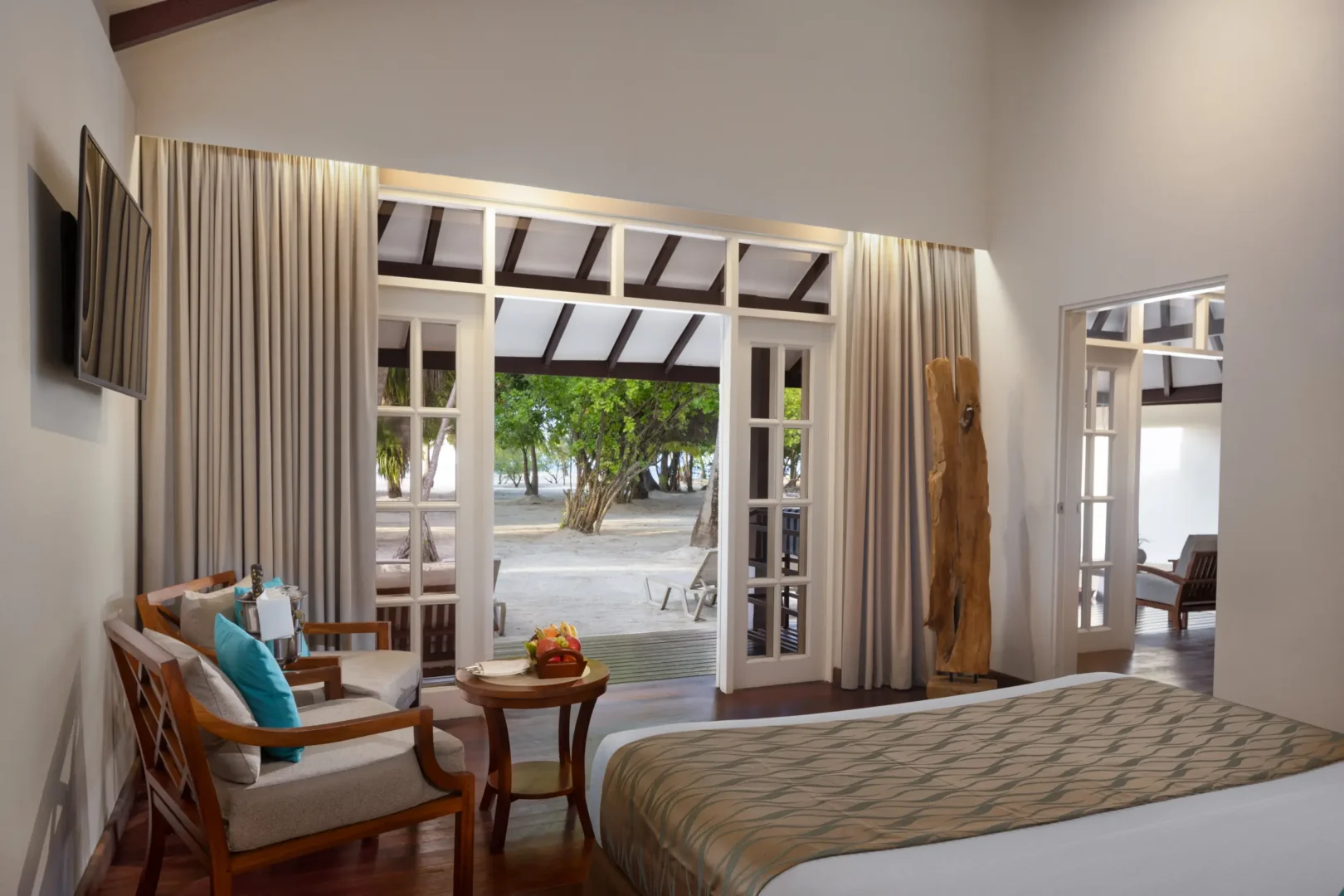 adaaran select meedhupparu raa atoll maldives deluxe family beach villa living area space