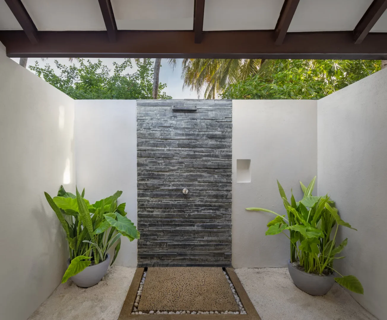adaaran select meedhupparu raa atoll maldives deluxe family beach villa outdoor shower