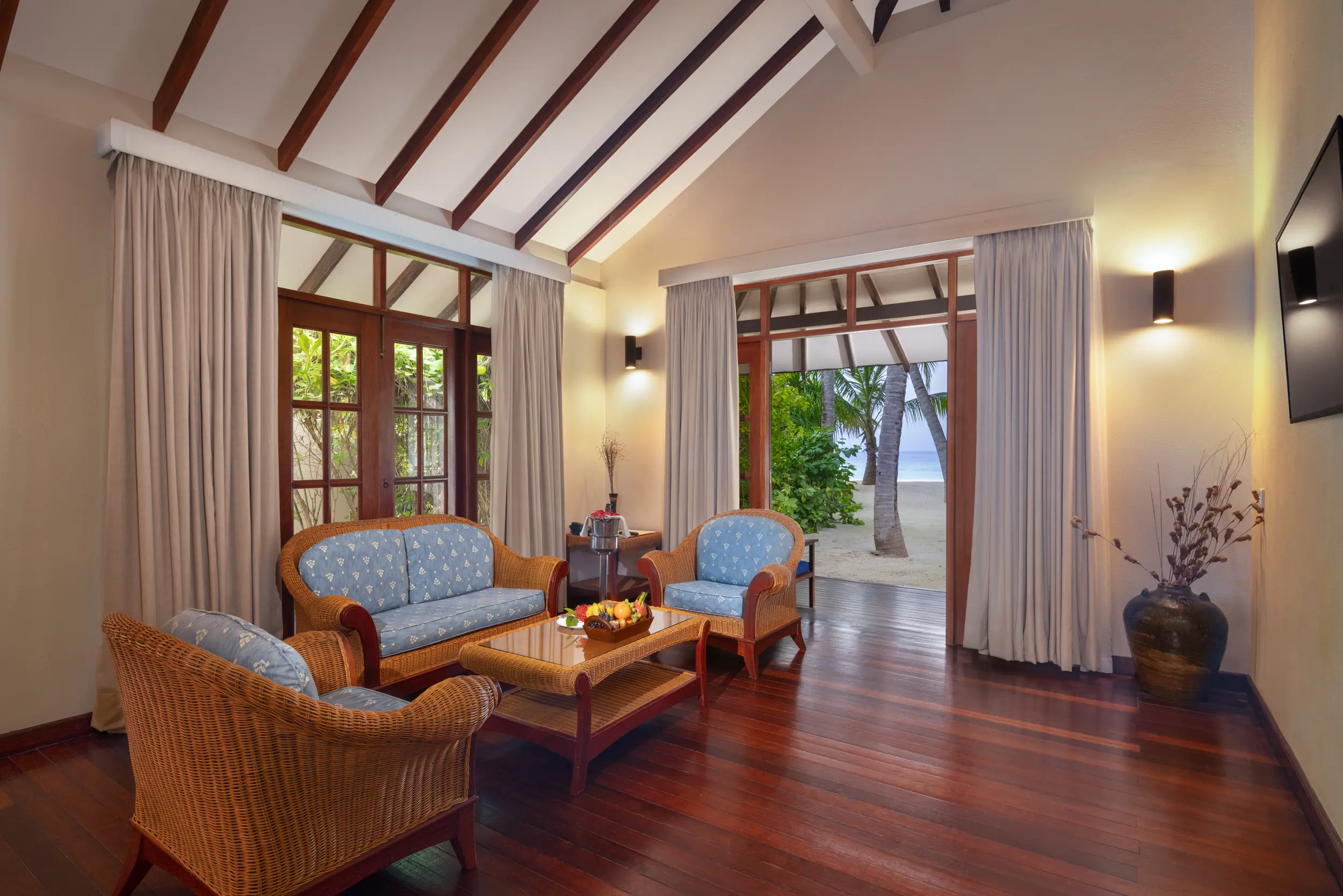 adaaran select meedhupparu raa atoll maldives honeymoon suite living area lounge