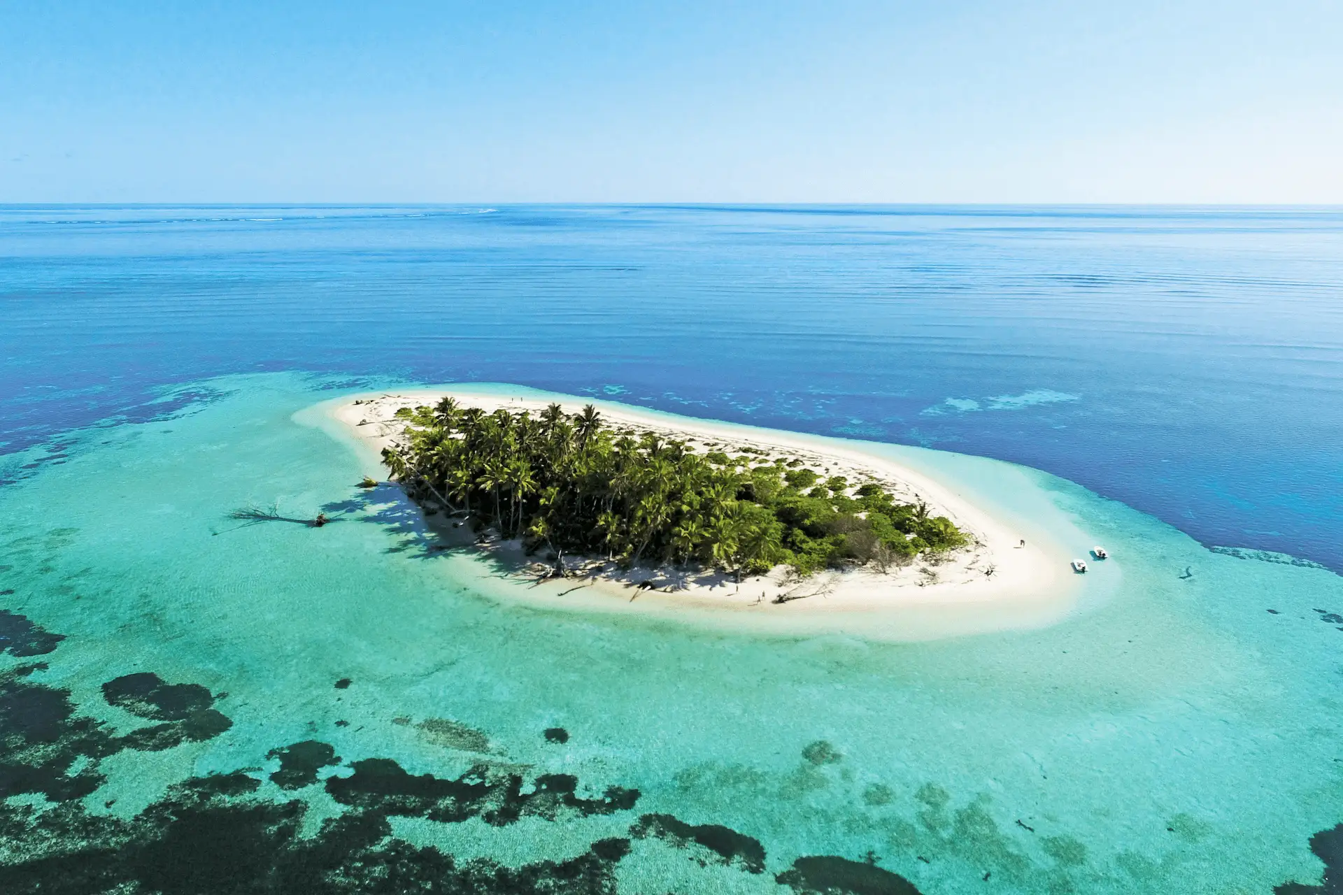 alphonse island seychelles aerial view showing white sand beaches, turquoise lagoon, and surrounding coral reefs