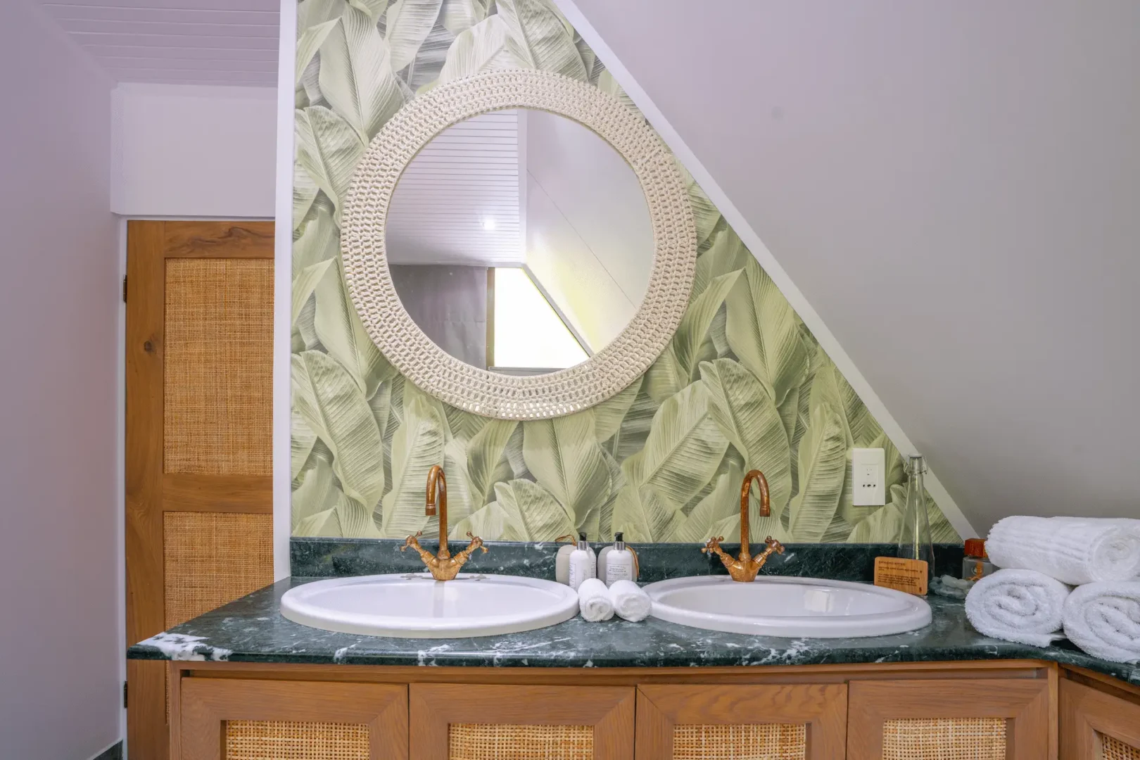 alphonse island seychelles the beach bungalow bathroom with double sinks, modern fixtures, and ocean or garden views