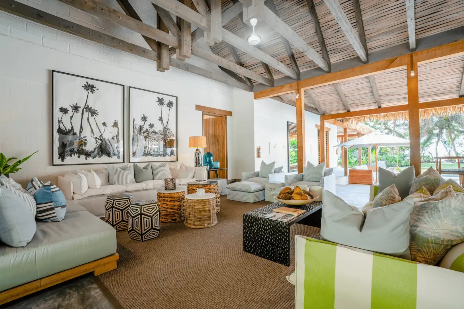 alphonse island seychelles the beach retreat lounge with spacious seating, tropical décor, and panoramic ocean views