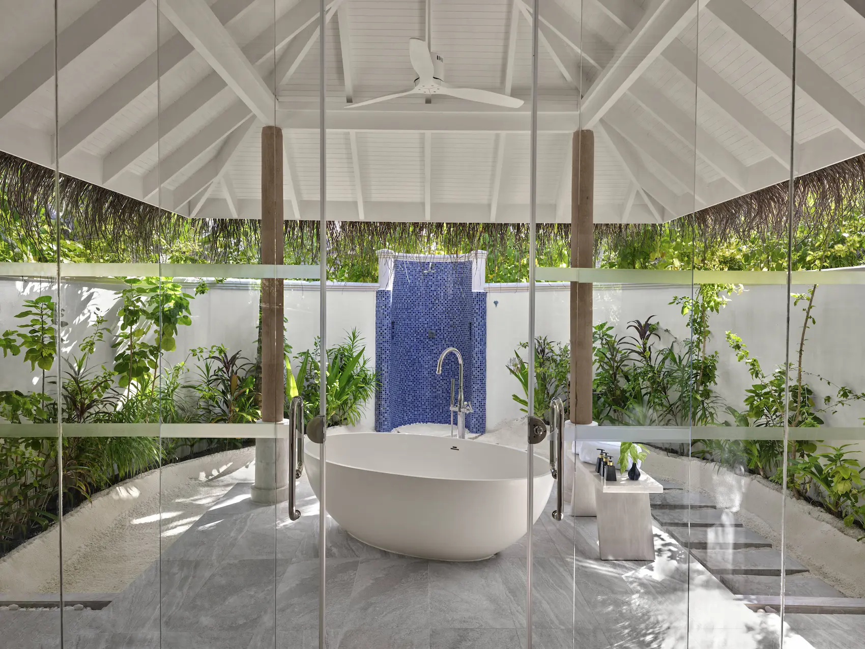 anantara dhigu maldives resort beach villa bathroom with glass door