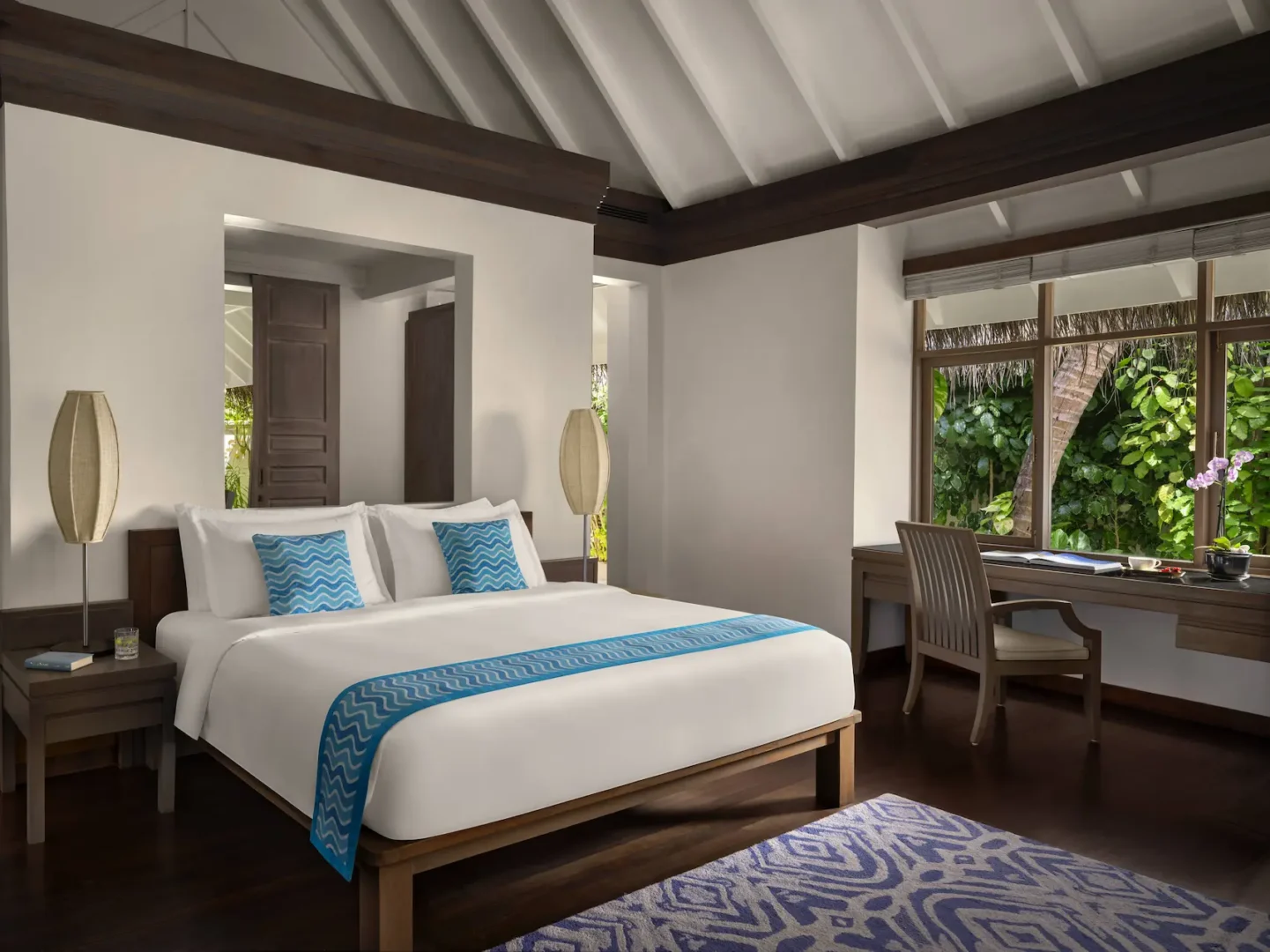 anantara dhigu maldives resort beach villa interior bedroom side view