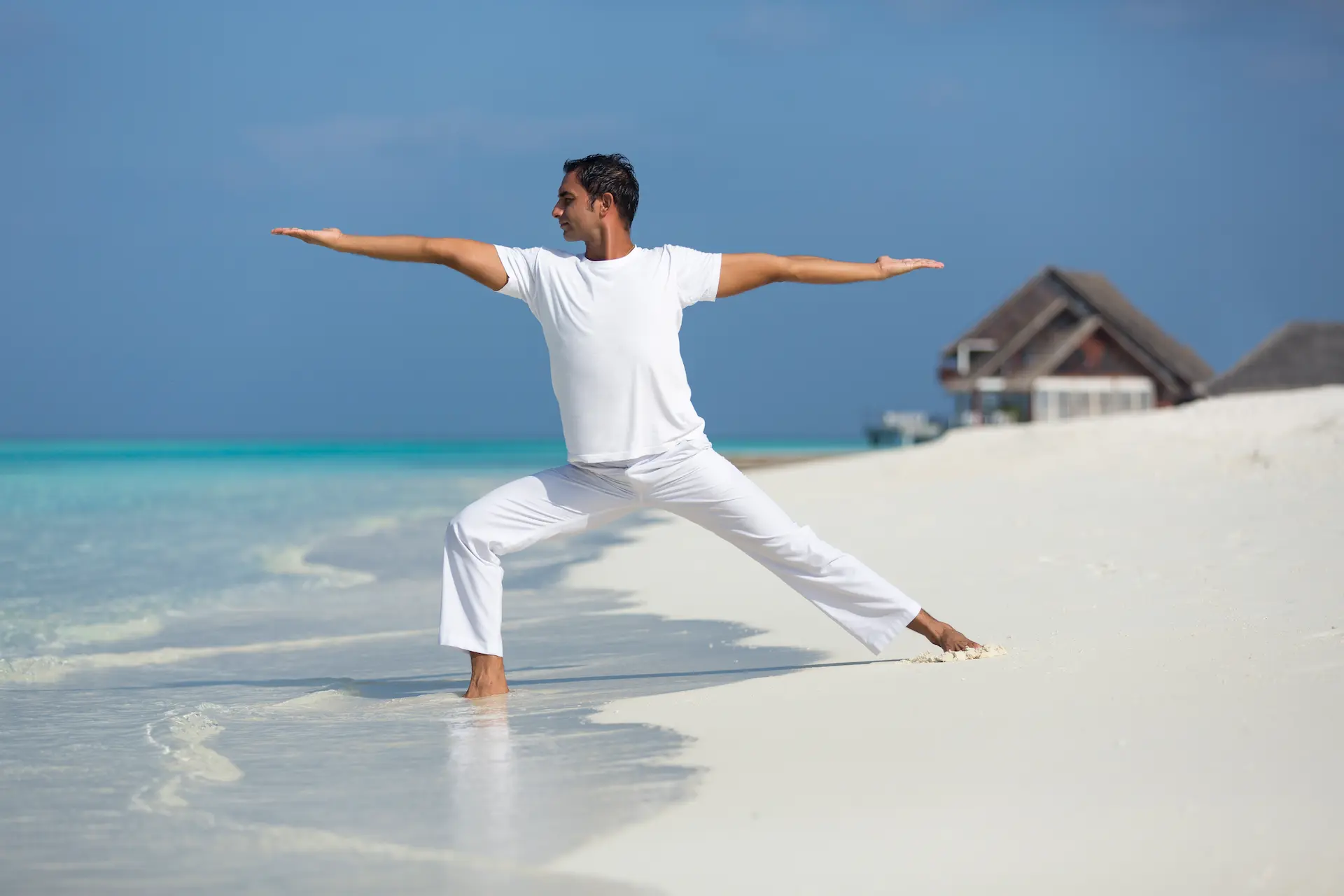 anantara dhigu maldives resort beach yoga instructor
