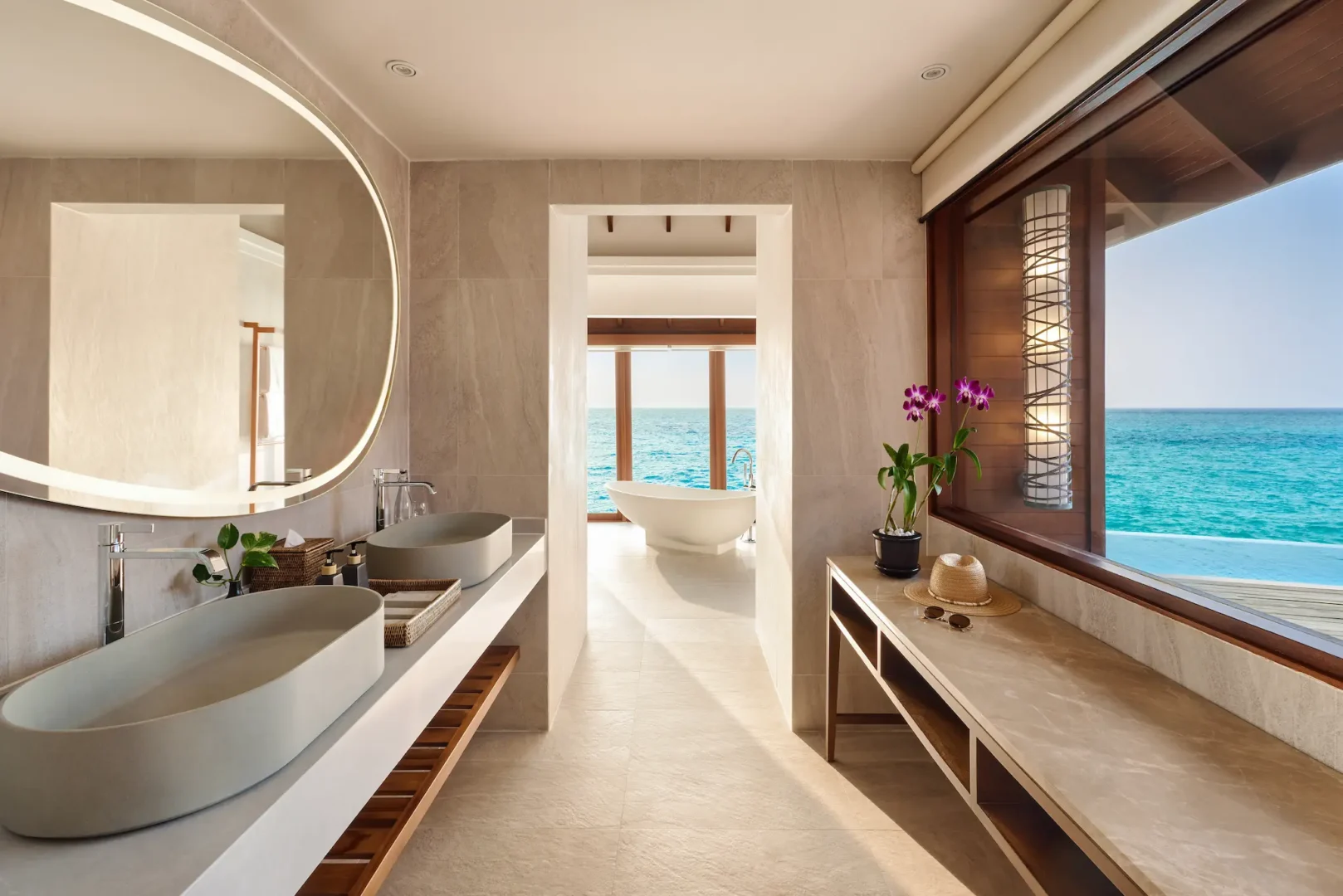 anantara dhigu maldives resort deluxe sunset over water pool villa bathroom
