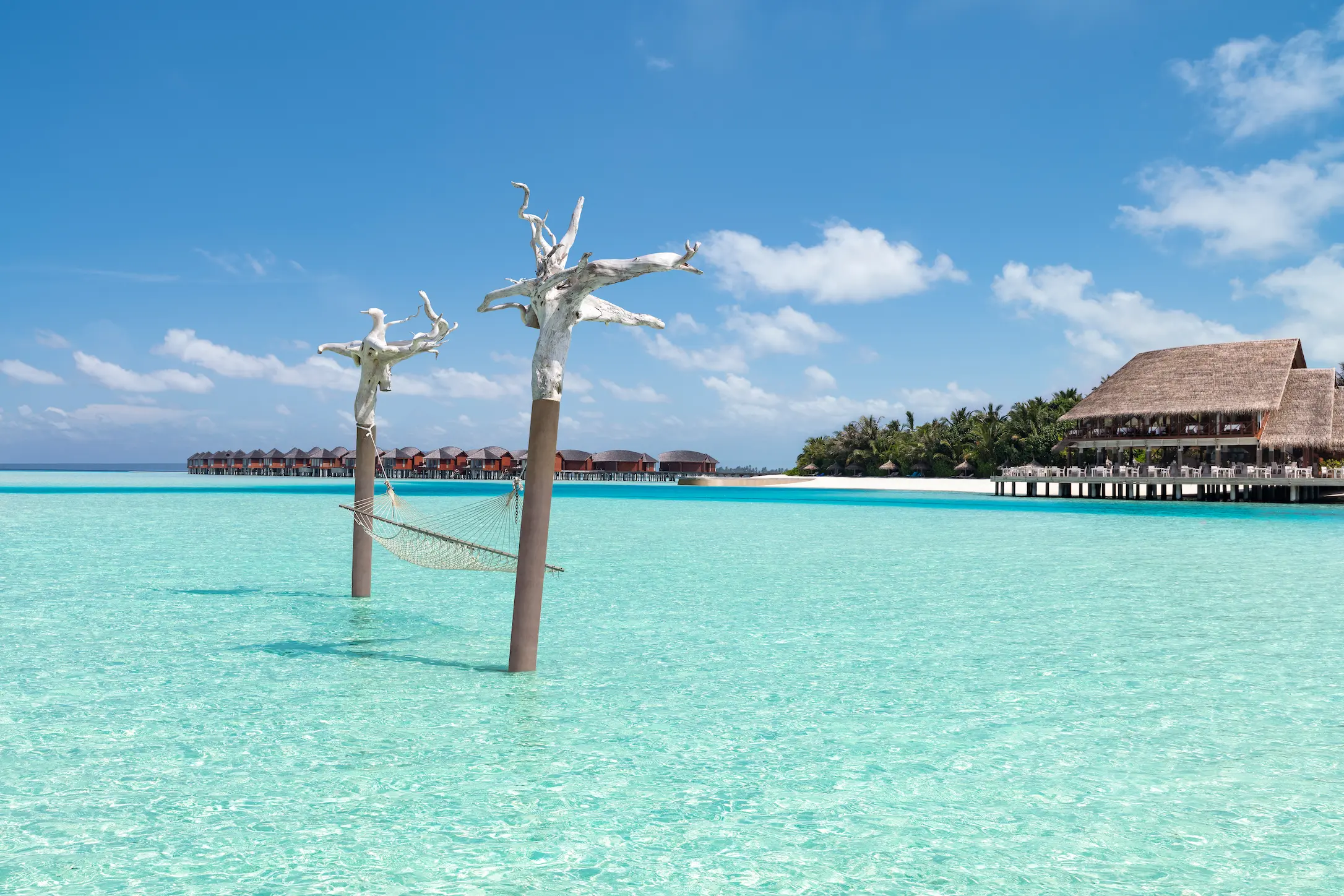anantara dhigu maldives resort exterior view hammock in the sea